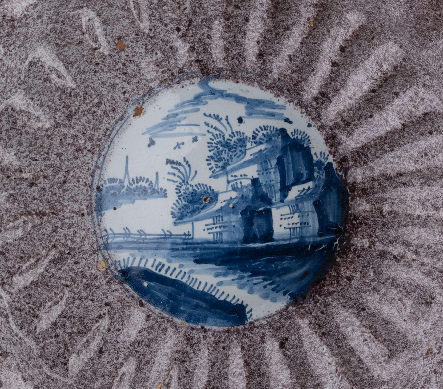 Baroque Delft Blue and white lobed dish with village in a manganese powdered border For Sale