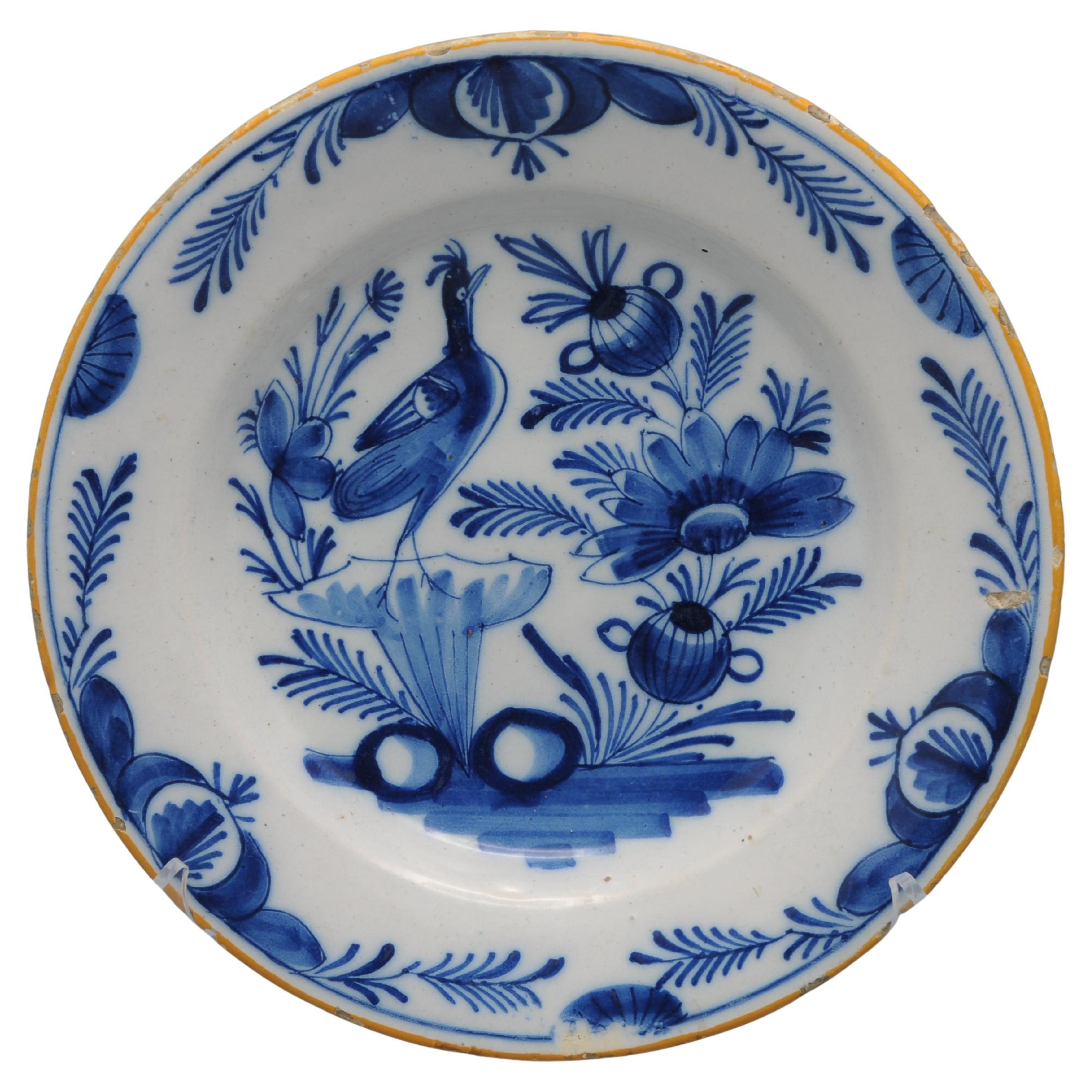Delft blue and white plate with a bird - early 19th century