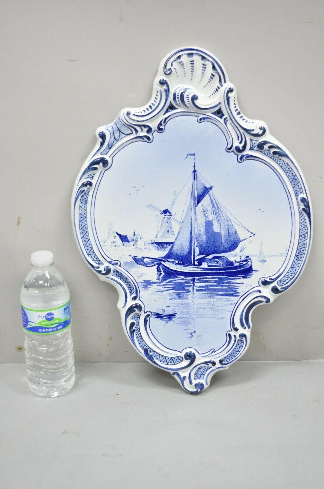Delft Blue Boch Freres La Louviere Porcelain Ship Wall Charger Plate. Item features a blue and white color, central ship design, shaped boarder, holes for wall hanging. Circa Mid to Late 20th Century. Measurements: 18