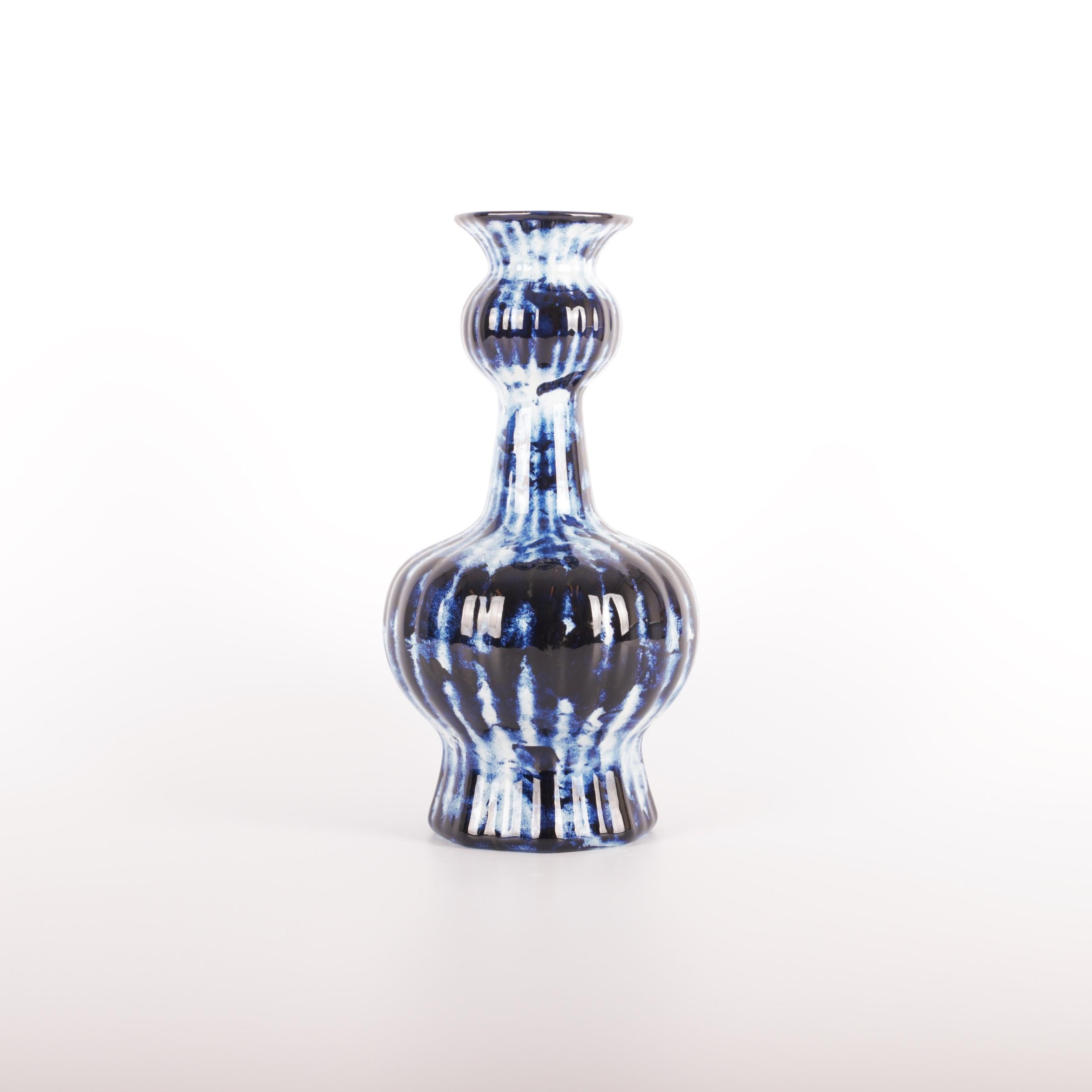 The Delft Blue Longneck Vase is available as an exclusive Personal Edition, Marcel Wanders' label carrying works of a more personal and experimental nature. The pieces of the Delft Blue series are unlimited unique by Marcel's one minute delft blue