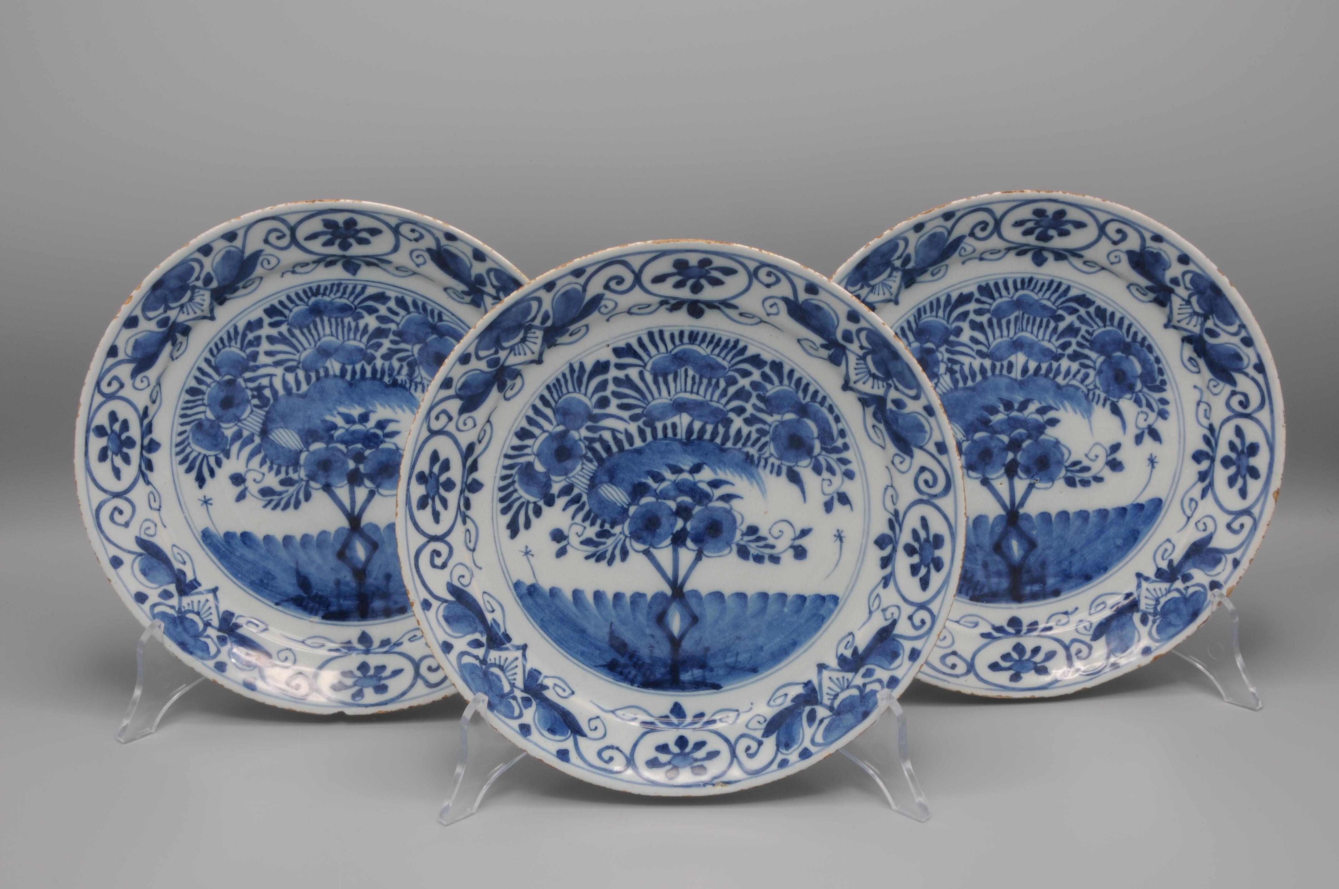 Set of  Blue Delftware plates with chinoiserie decoration of a central depiction of a 