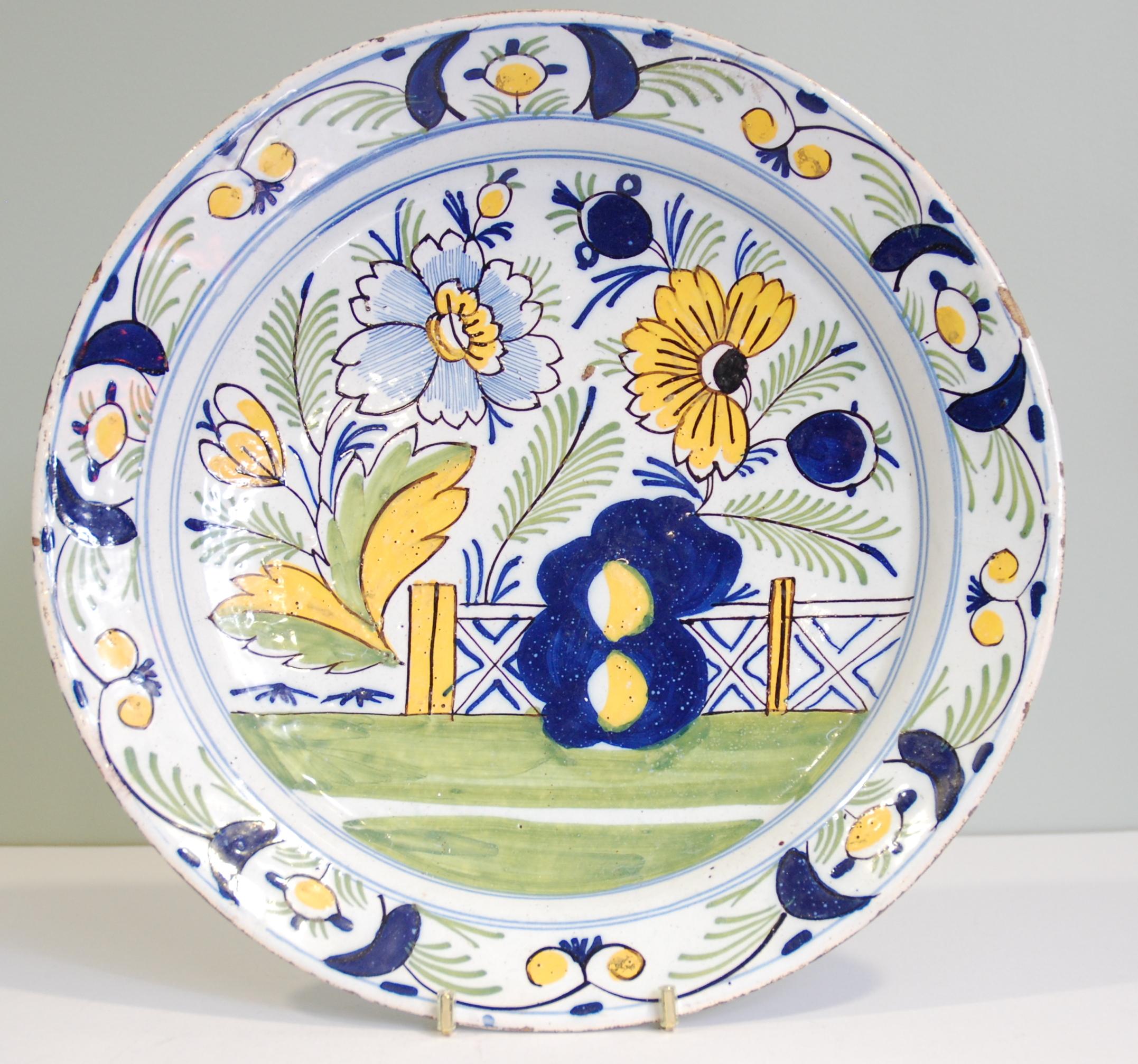 A fine and large charger, with typical polychrome decoration.

English Delftware is considered to be one of the most important forms of English ceramic production of the period, and it had a major influence on the development of the British ceramics