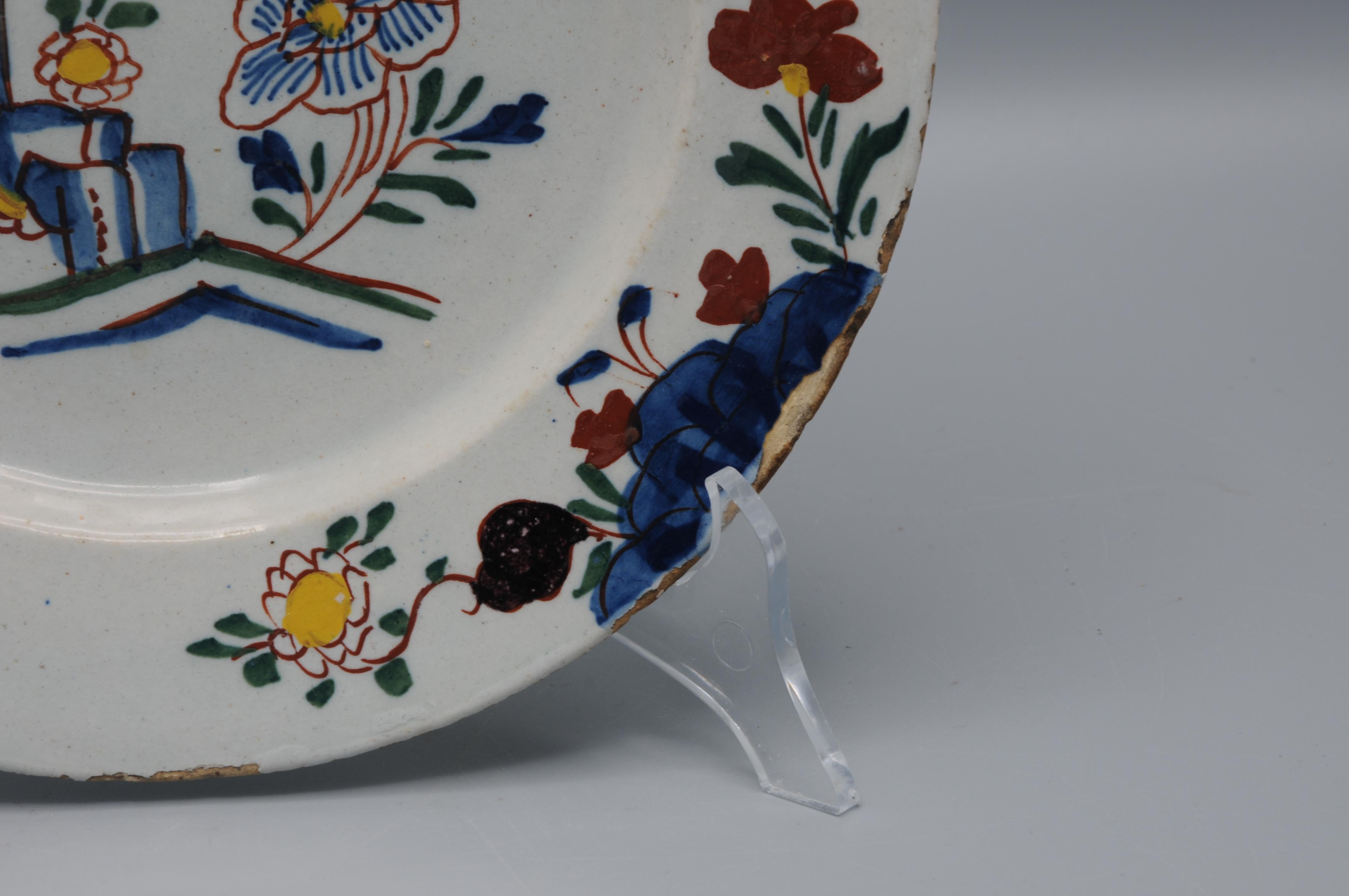 Dutch Delft - Delftware plate with polychrome floral decor - mid 18th century For Sale
