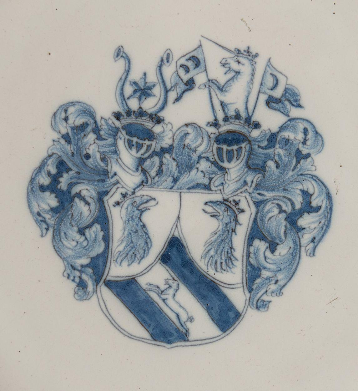 Blue and white armorial charger. Delft or Haarlem, 1650-1680

This large charger has a wide-spreading flange and is decorated in the center with a coat of arms in blue, made up of a shield adorned with two helmets and mantle. The shield is divided