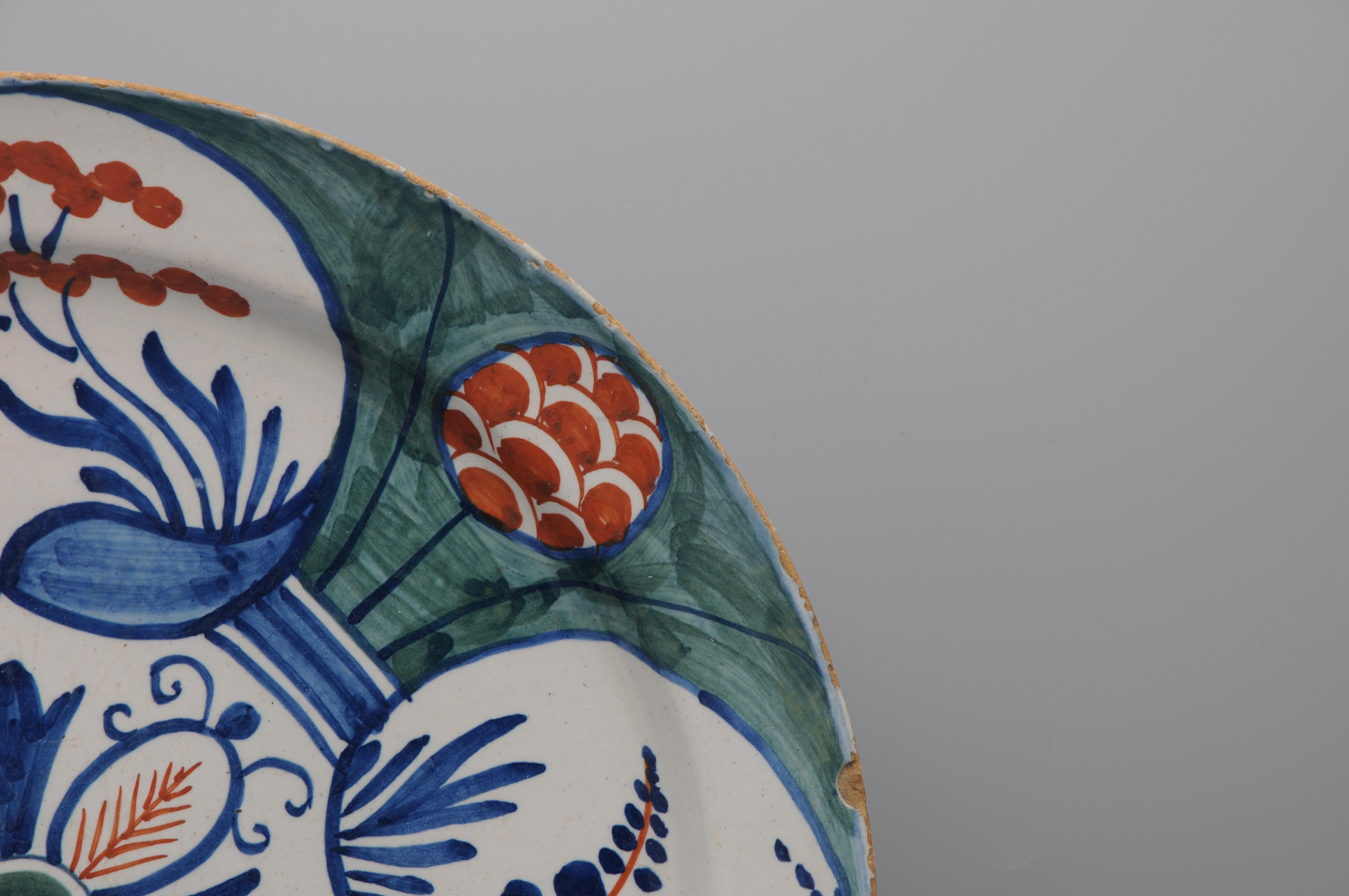 Dutch Delft - Large green and polychrome 'Four Hearts' charger -  mid 18th century For Sale
