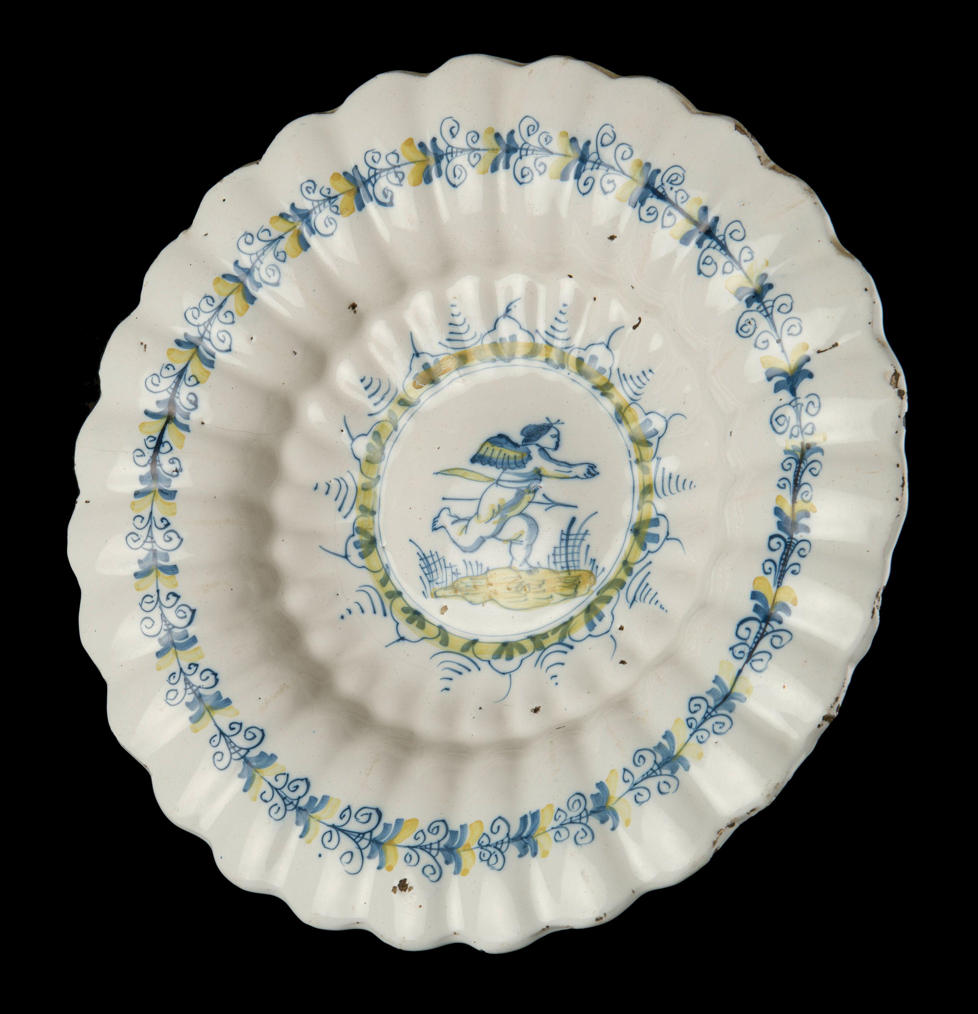 Baroque Delft, Lobed Dish with Putto in Blue and Yellow, 1630-1660