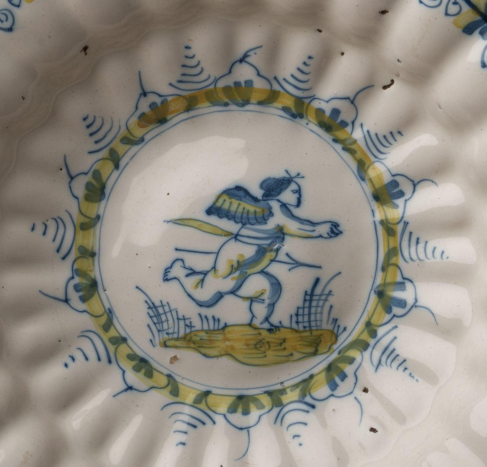Dutch Delft, Lobed Dish with Putto in Blue and Yellow, 1630-1660