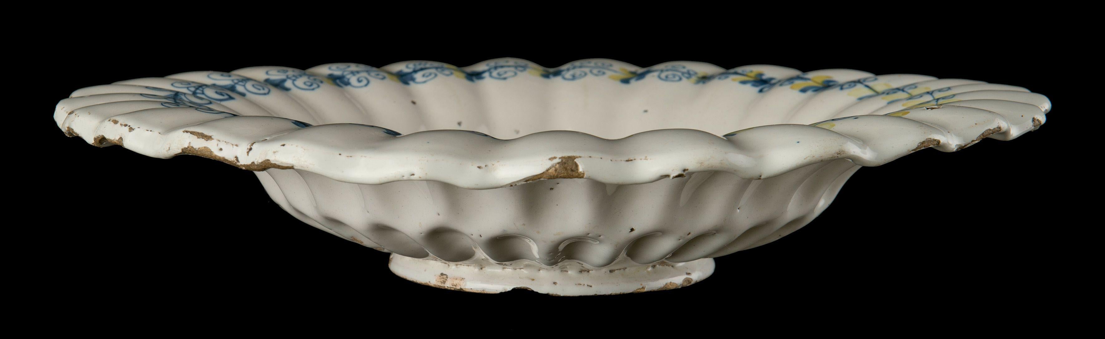 18th Century and Earlier Delft, Lobed Dish with Putto in Blue and Yellow, 1630-1660
