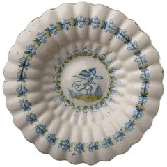 Used Delft, Lobed Dish with Putto in Blue and Yellow, 1630-1660