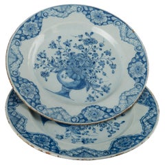 Antique Delft Pair of blue and white plates with flower vases dated 1760