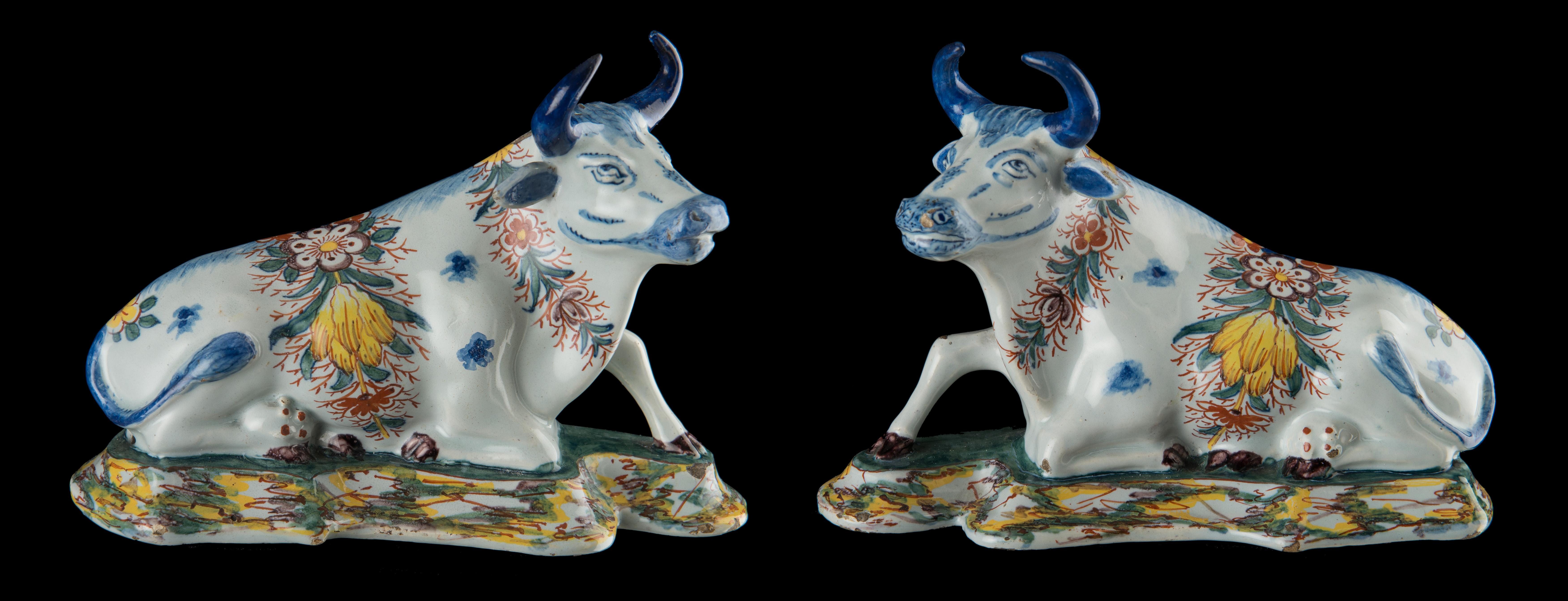 Pair of polychrome reclining cows, Delft, circa 1760 
The Two Ships pottery. Mark: AP, period of Anthonij Pennis (1750-1770) or his widow Rachel Overgaauw-Pennis (1770-1782) 
The two modelled reclining cows lie on a base and have their heads turned