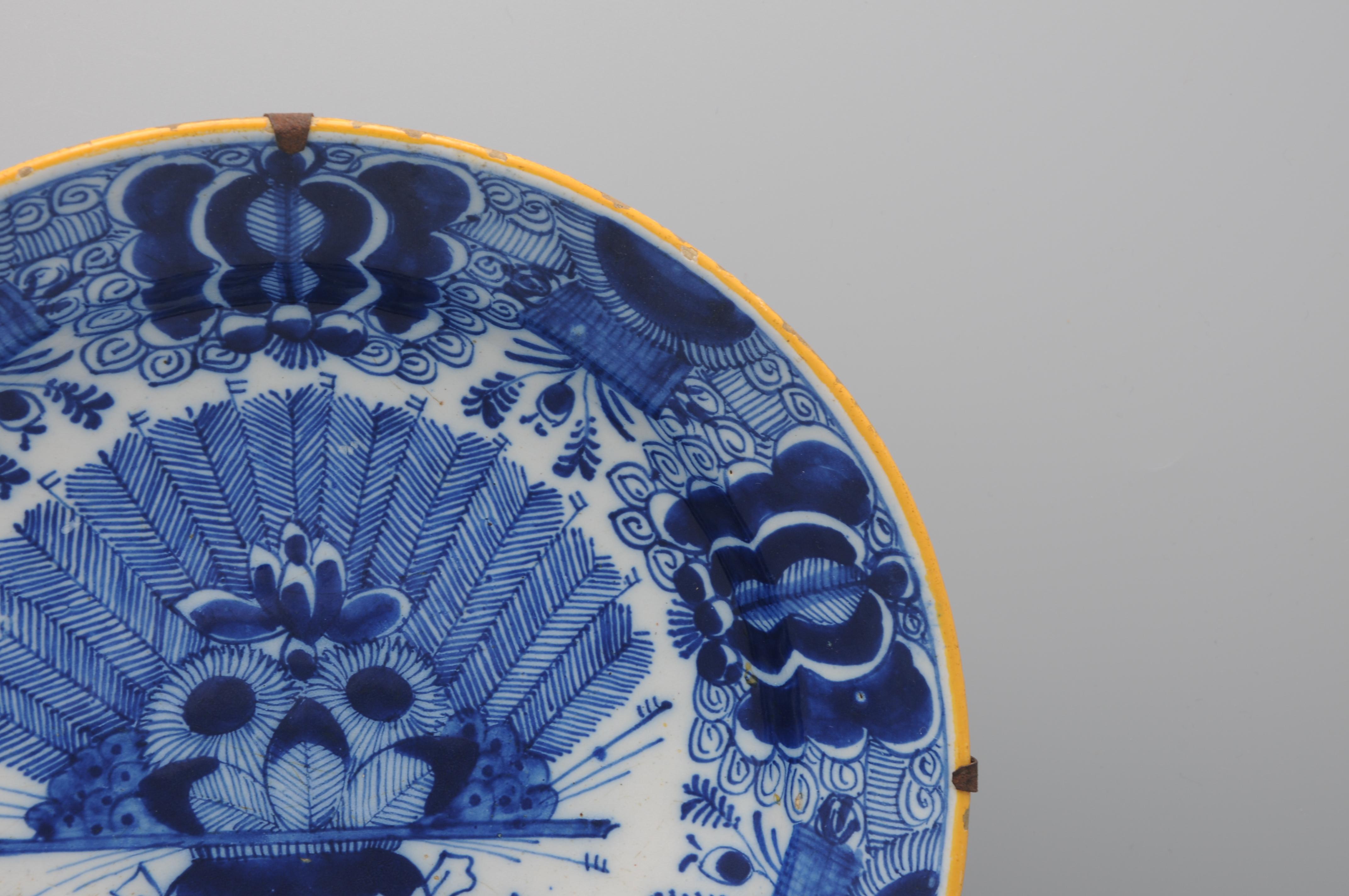 Delft 'Peacock' plate by 'De Claauw' - second half 18th century For Sale 2