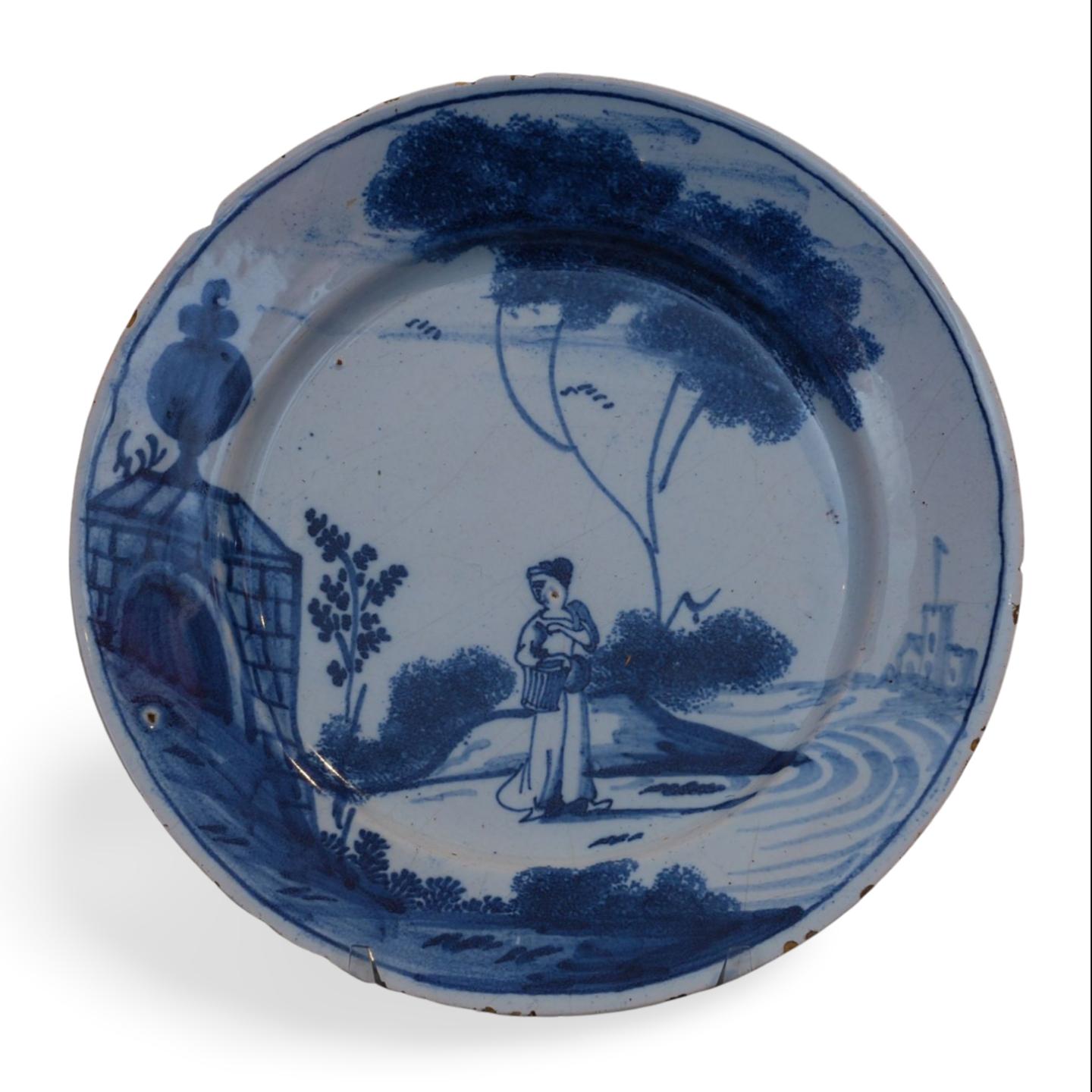 Tin-glazed earthenware, decorated with a woman in a landscape. Known as a monument plate, after the monument surmounted by a vase.

Prov: Troy Chappell coll., from Allister Sampson.

English Delftware is considered to be one of the most important