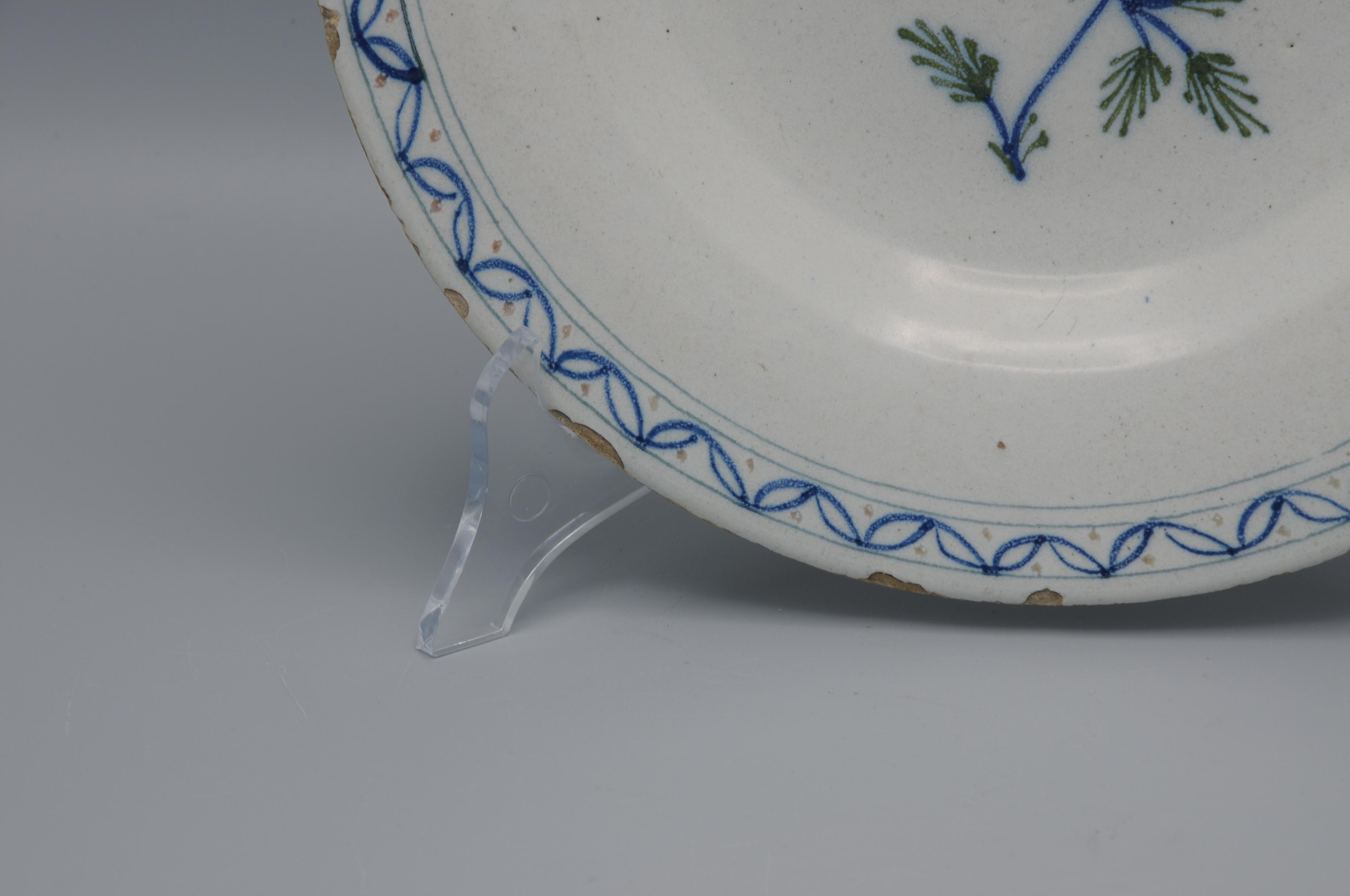 Glazed Delft, Plate with manganese rose - 18th century