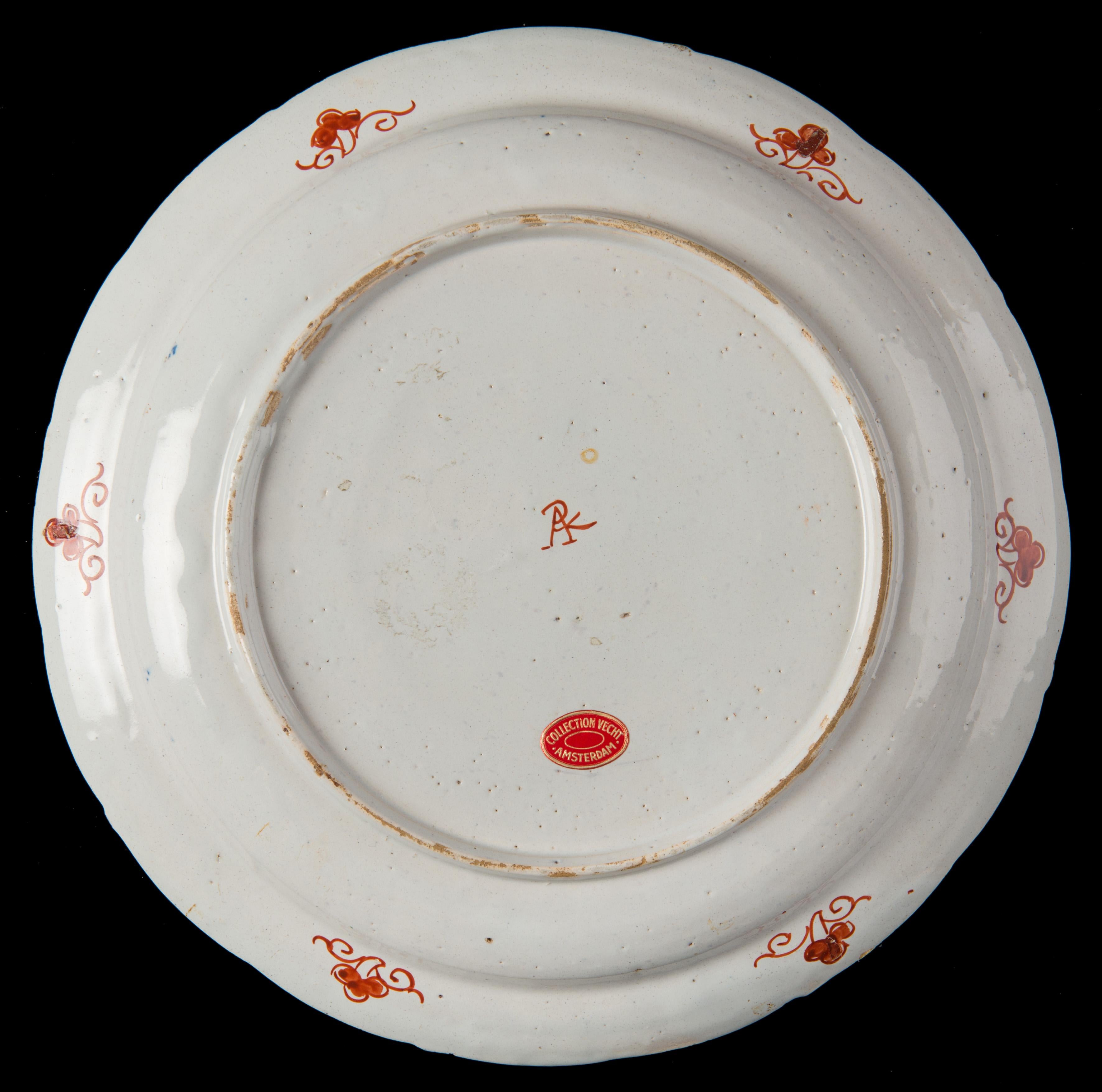 Polychrome and gilded chinoiserie plate. Delft, 1701-1722 The Greek A pottery.
Mark: APK, period of Pieter Kocx (1701-1703) or his widow Johanna van der Heul (1703-1722)

The plate is slightly curved and has a narrow border. The painting is