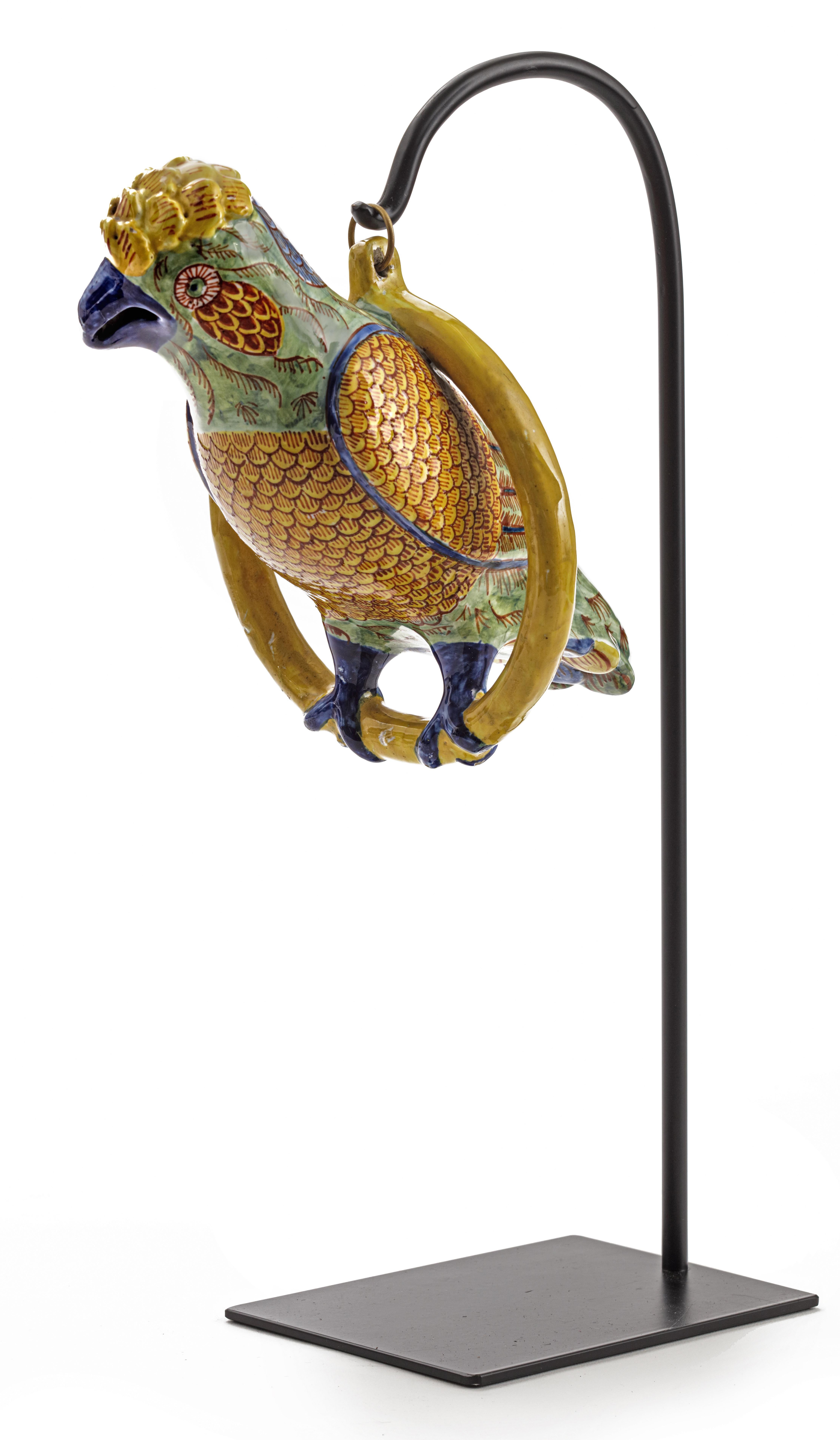 A fabulous polychrome enameled earthenware parrot
Delft or France, 18th or 19th century

Suspended from a ring, with modern powder-coated stand.

Measure: L parrot 26 cm.

 