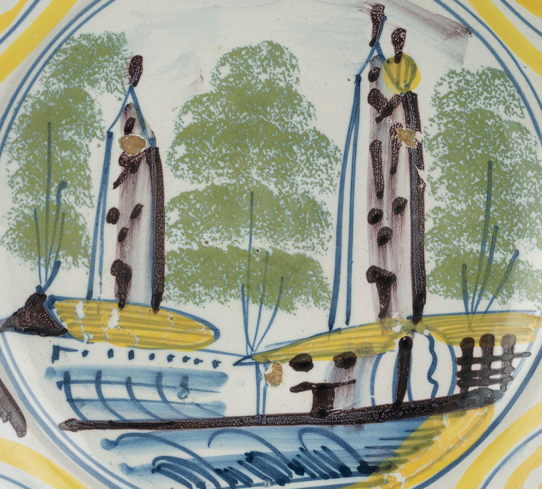 Baroque Delft Polychrome majolica dish with a village view The Netherlands, 1700-1750  For Sale