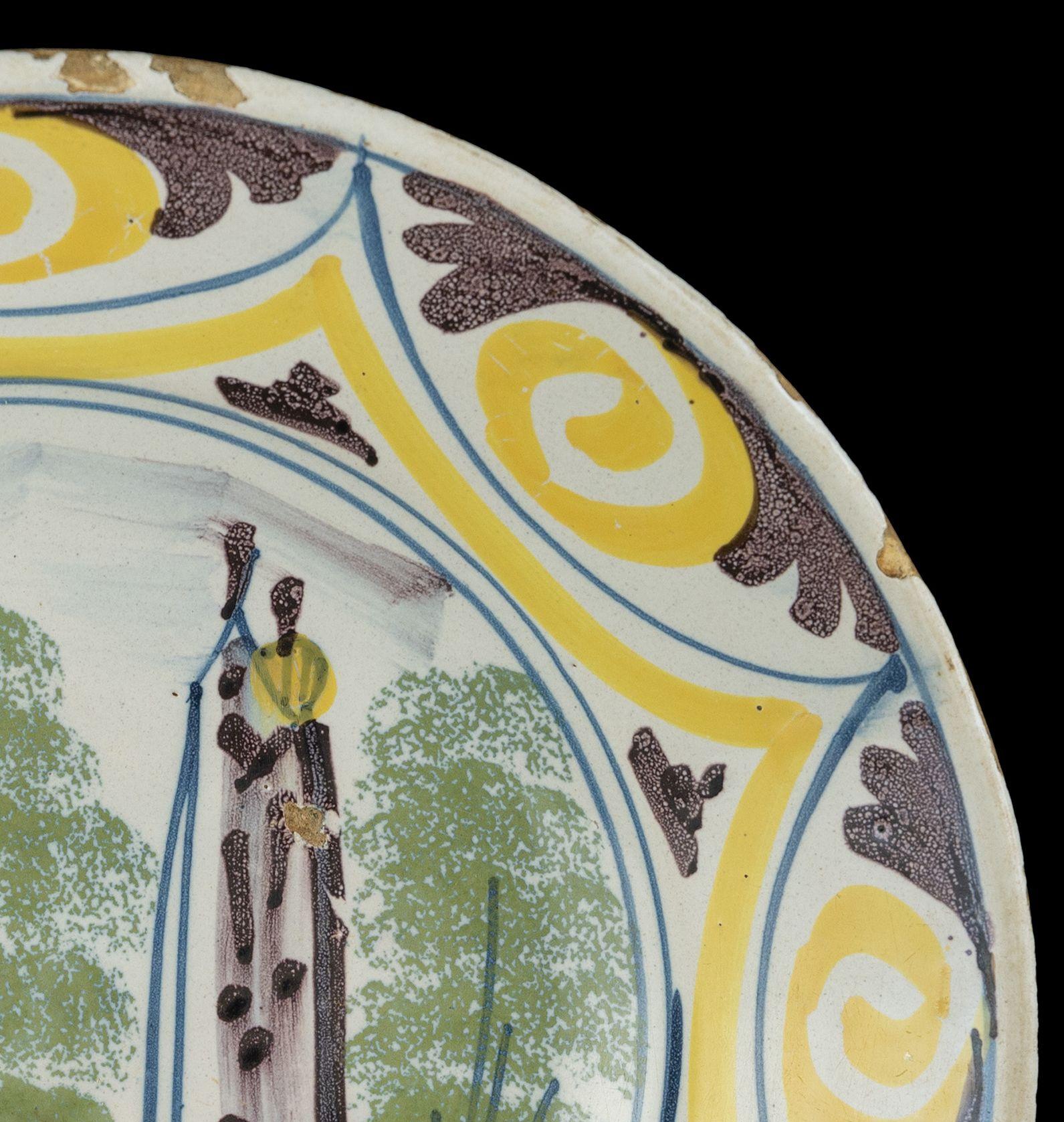 Glazed Delft Polychrome majolica dish with a village view The Netherlands, 1700-1750  For Sale