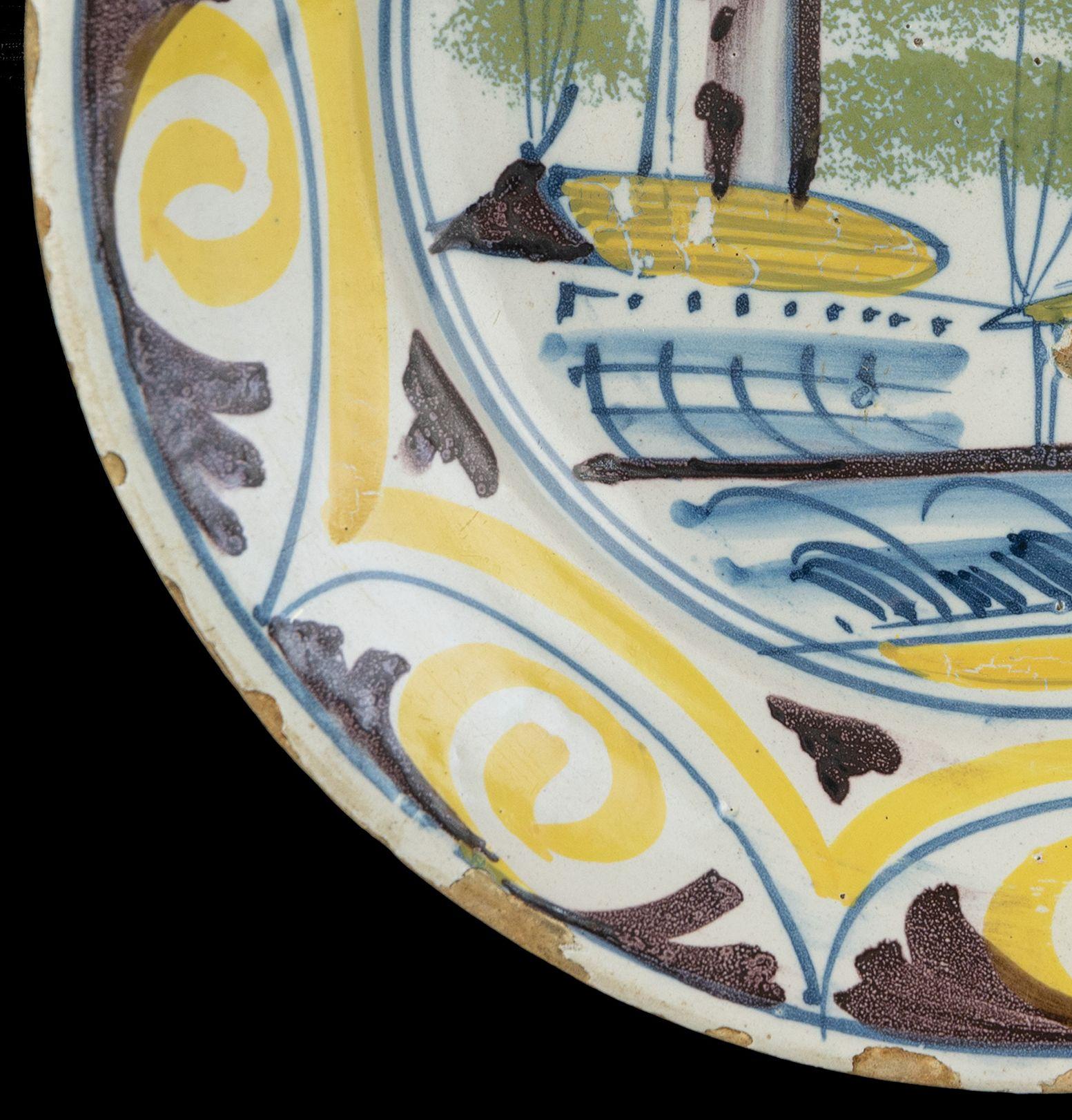 18th Century Delft Polychrome majolica dish with a village view The Netherlands, 1700-1750  For Sale