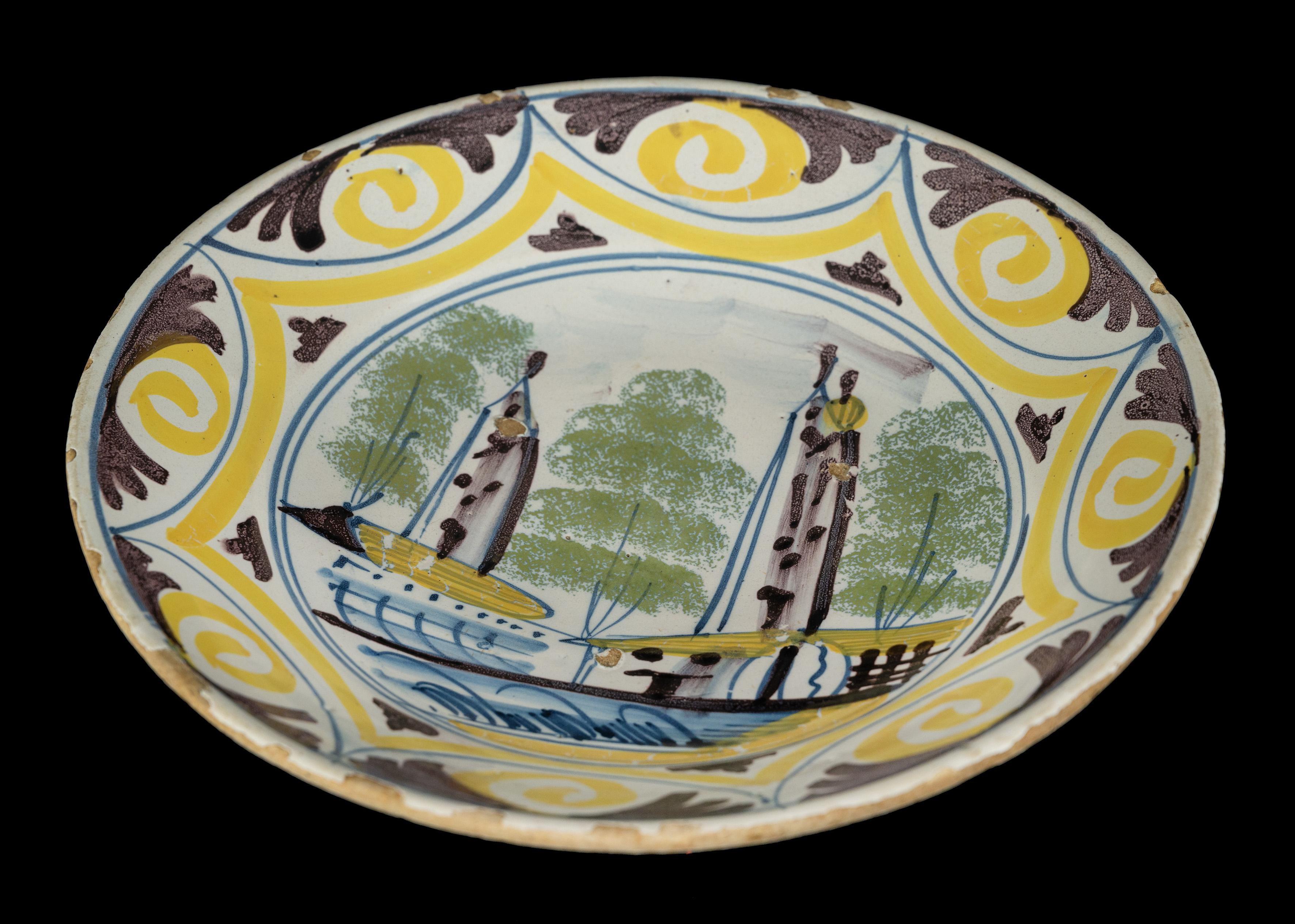 Ceramic Delft Polychrome majolica dish with a village view The Netherlands, 1700-1750  For Sale