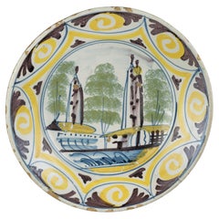 Antique Delft Polychrome majolica dish with a village view The Netherlands, 1700-1750 