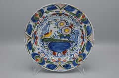 Delft, Polychrome plate with bird and flower vase - 18th century
