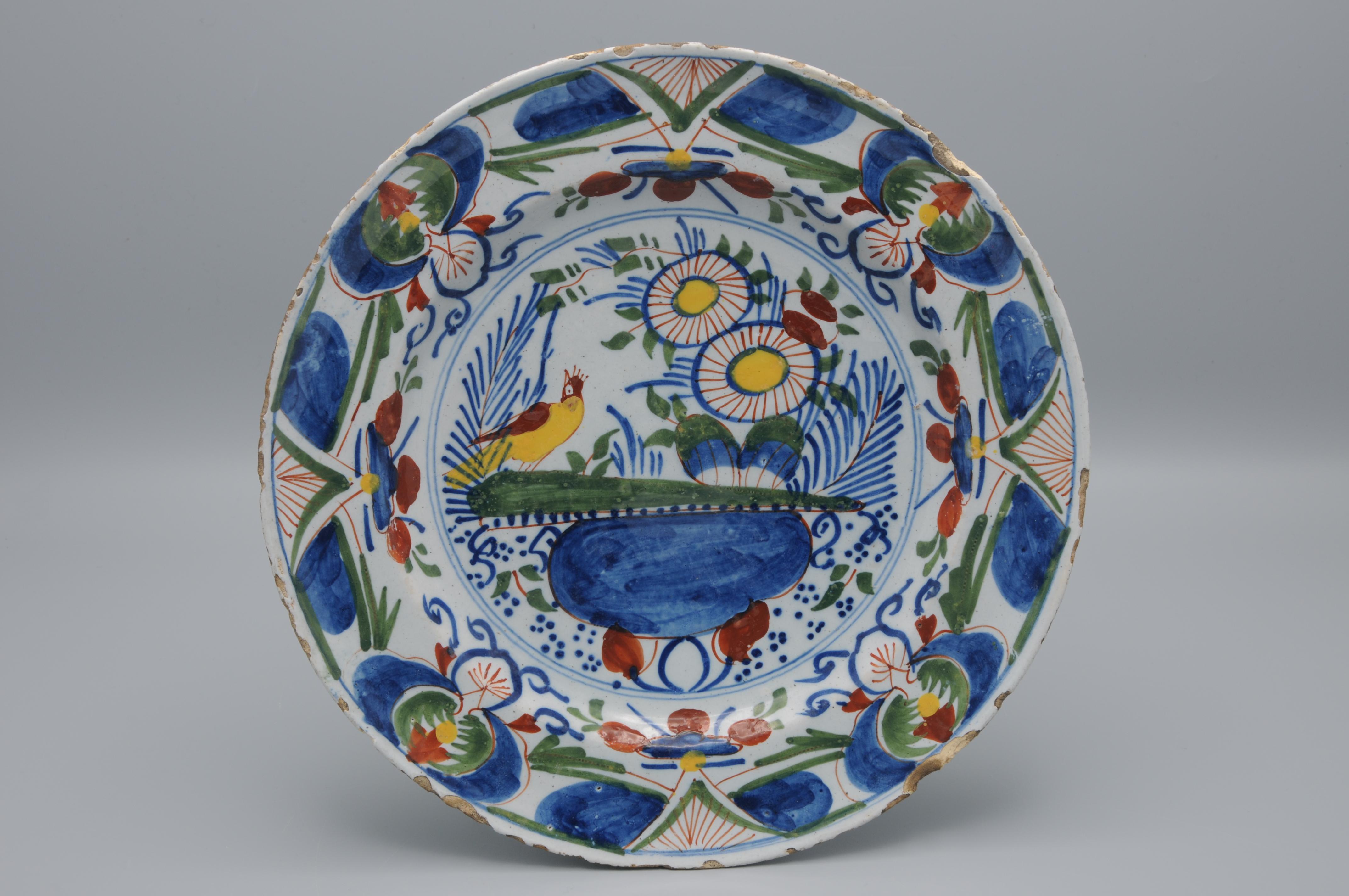 Dutch Delft, Polychrome plate with bird and flower vase - 18th century