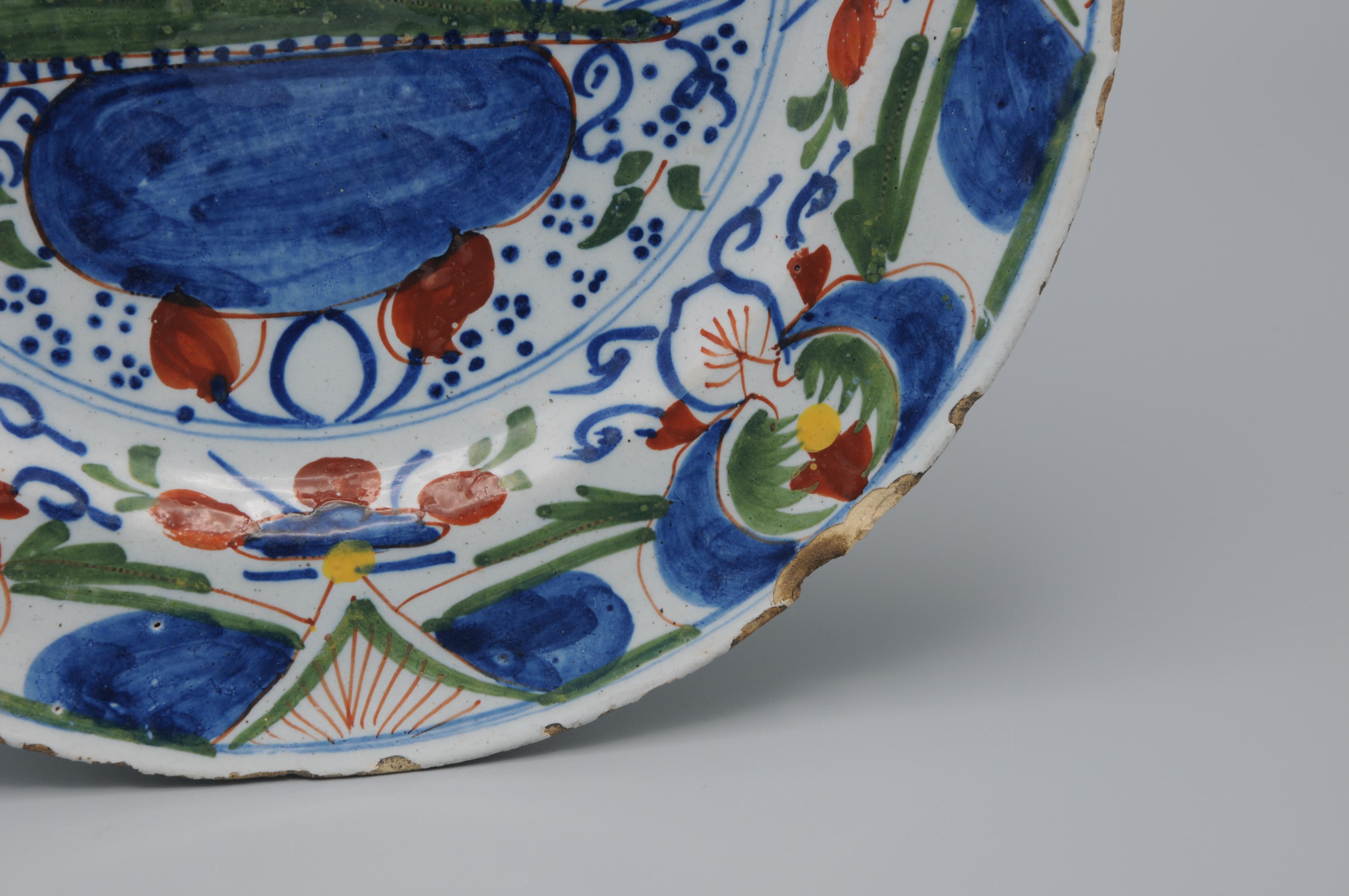 Glazed Delft, Polychrome plate with bird and flower vase - 18th century