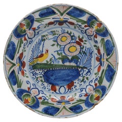 Delft, Polychrome plate with bird and flower vase - 18th century