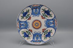 Delft polychrome plate with cartouches and mascerons - 18th century