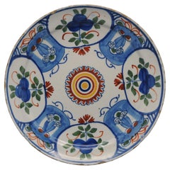 Delft polychrome plate with cartouches and mascerons - 18th century