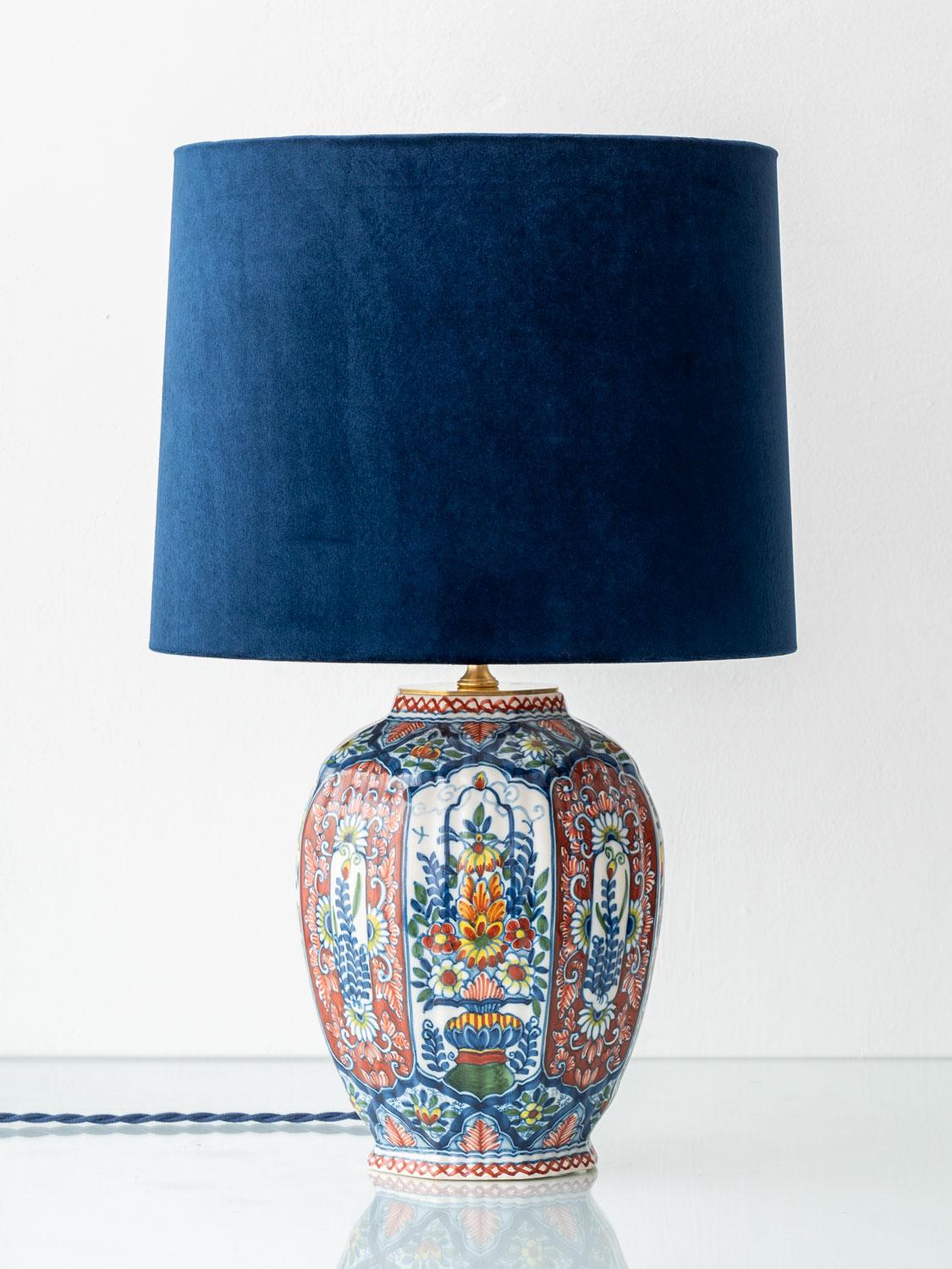 This vintage Delft polychrome table lamp, handcrafted by Amitābha Studio in Amsterdam, is made from a rare mid-20th century vase by Royal Tichelaar Makkum—Europe’s oldest ceramic manufacturer. We’ve paired the distinctive octagonal base with a deep