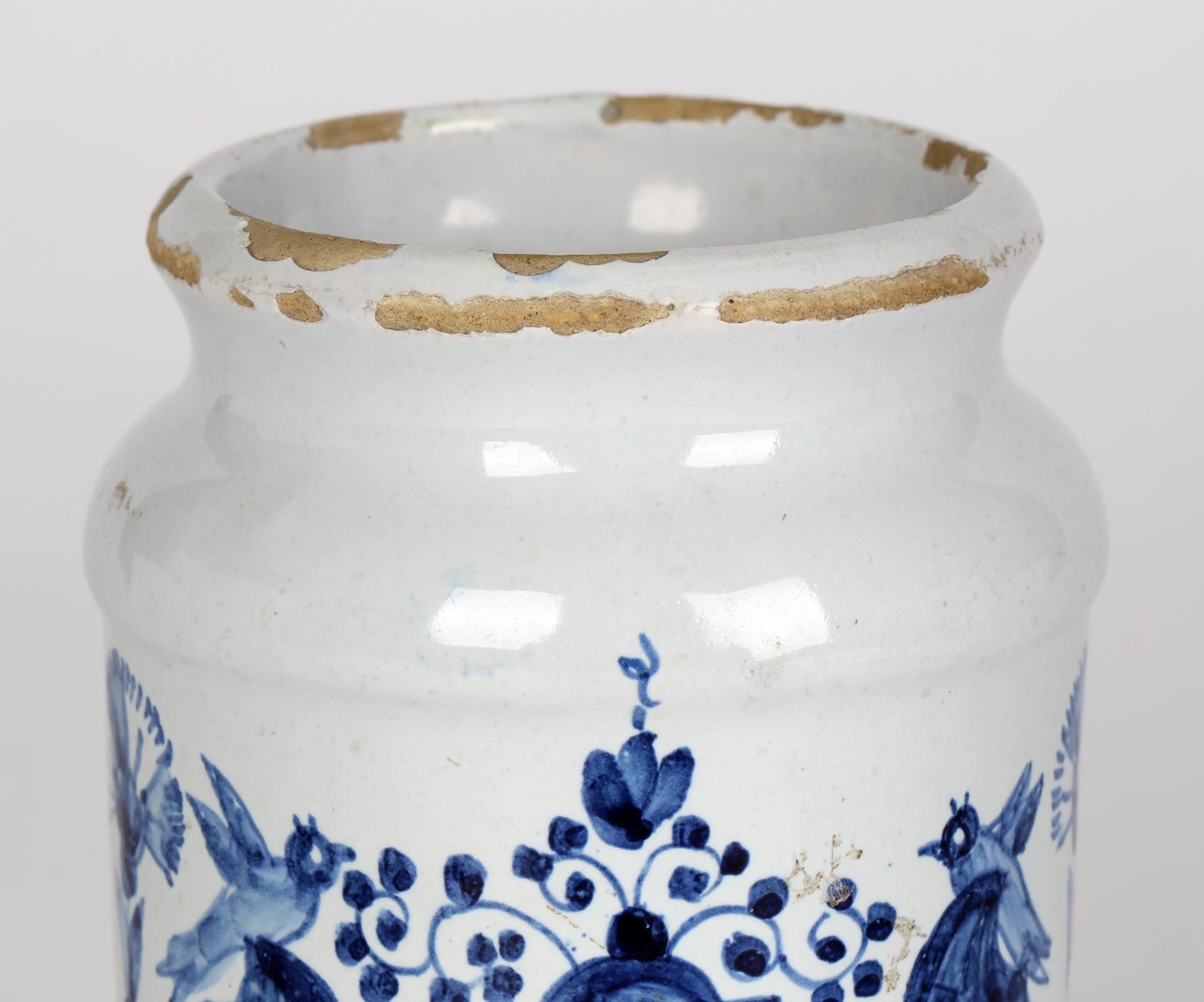 A good Delft blue and white pottery apothecary jar marked CONF.HIACINTOR and dating from around 1750. The jar, of cylindrical form stands on a rounded pedestal foot with a pinched top rim and slightly flared top. The jar is hand decorated with a