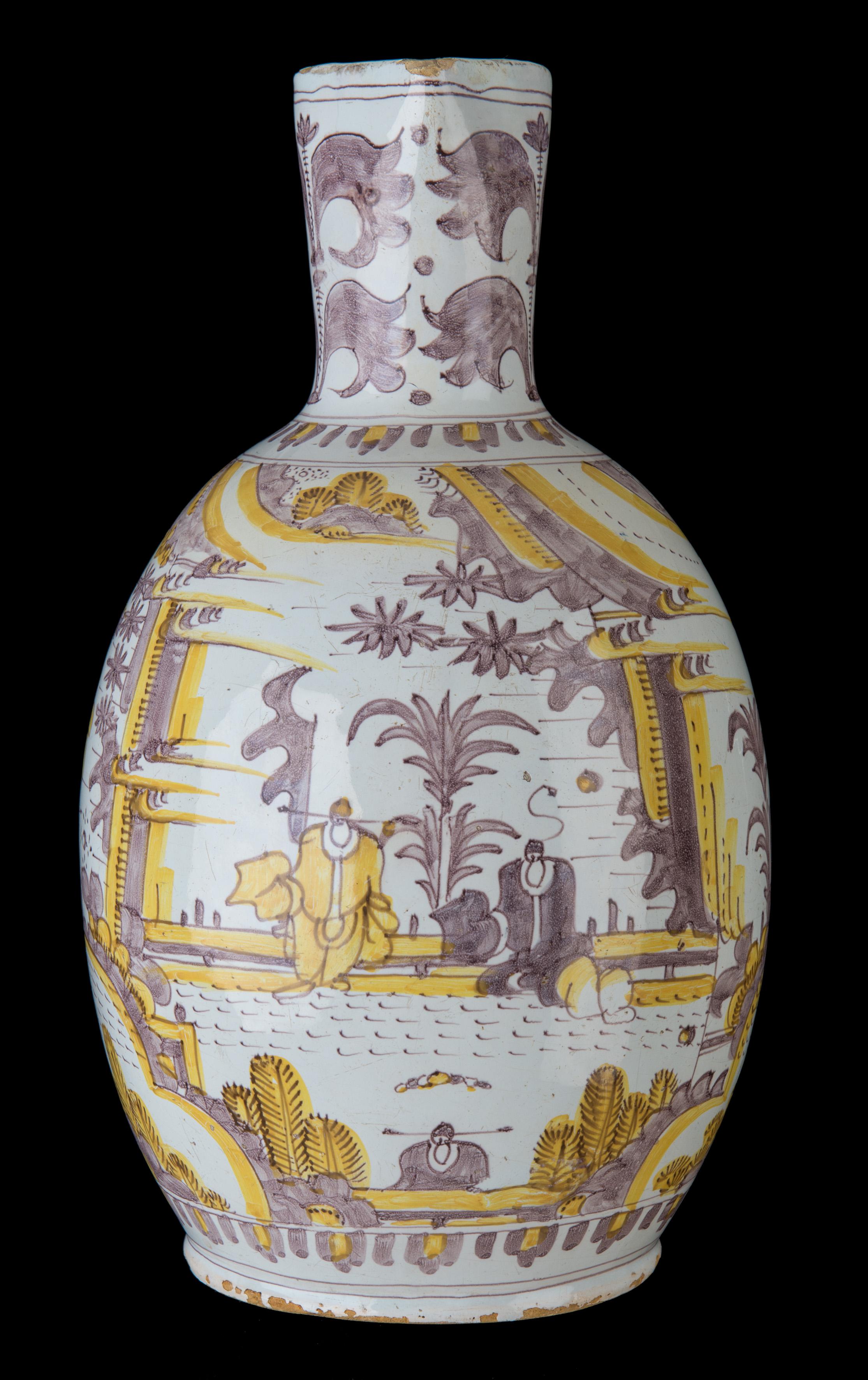 Purple and yellow chinoiserie jug. Delft, circa 1680 - 1700

The ovoid jug stands on a lightly spreading foot and has a tapered neck with spout. The top of the handle is pierced for a metal mount. The jug is painted in purple and yellow with a