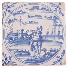 Delft scenic tile of girl astride a farm animal, c. 1600's