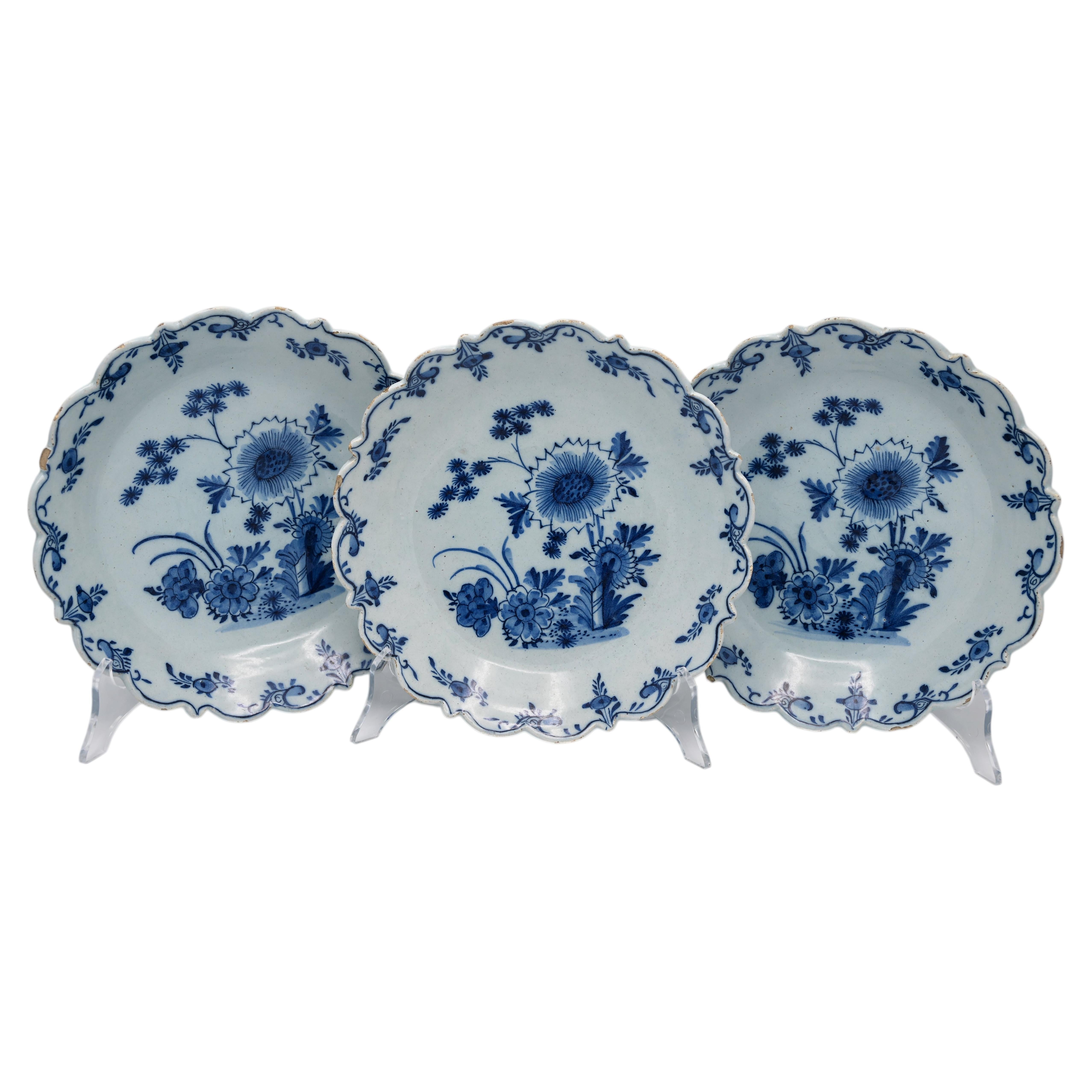 Antique Delft set of 18th century blue and white plates with scalloped rim