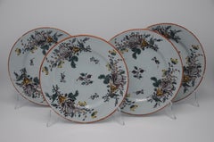 Delft - Set of four polychrome floral Delftware plates - 18th century