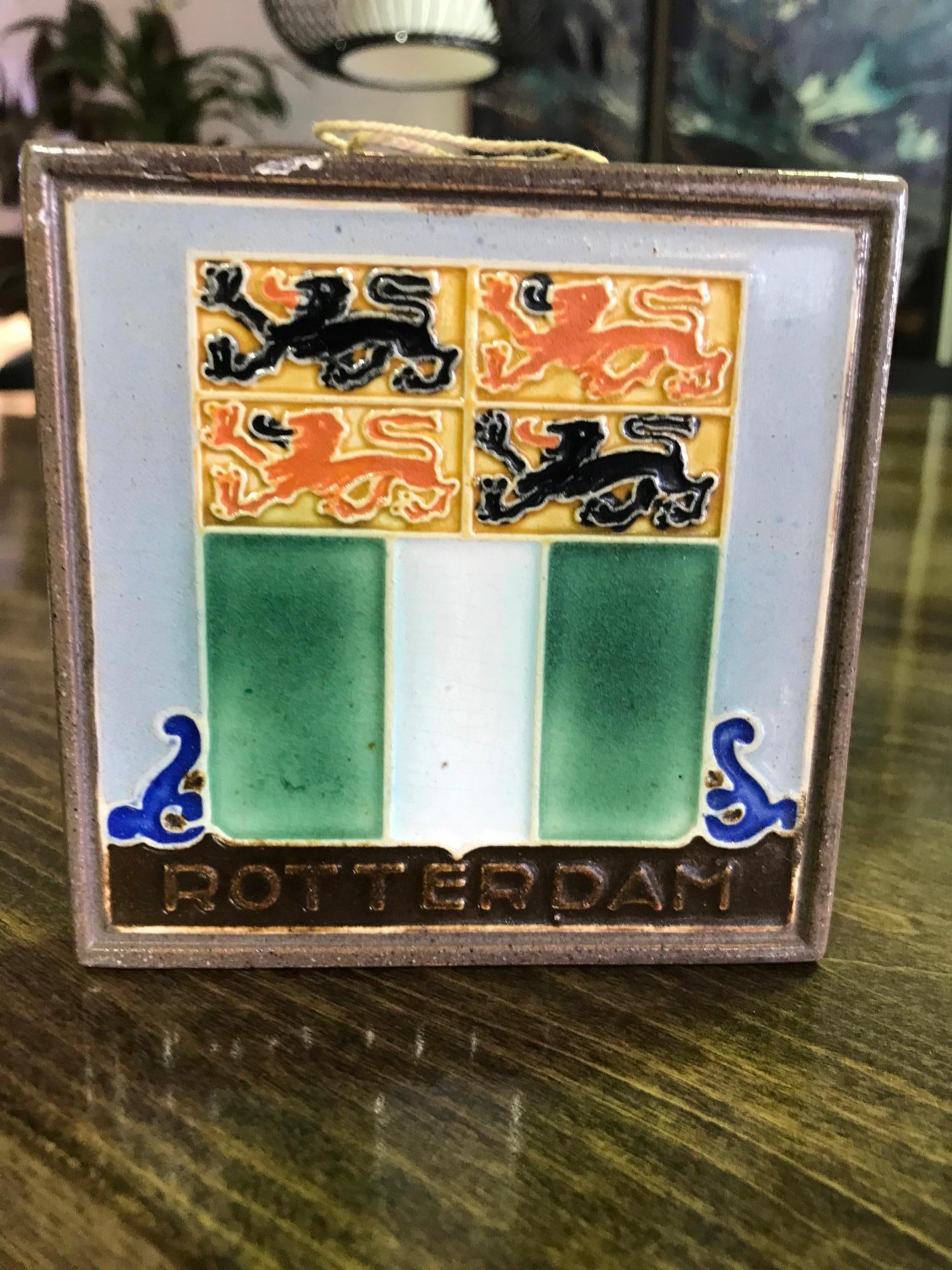 A colorful tile made by delft in the Netherlands.

Stamped 