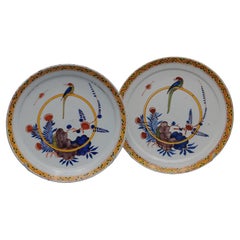 Delftware - Pair of plates with a Parrot, mid 18th century