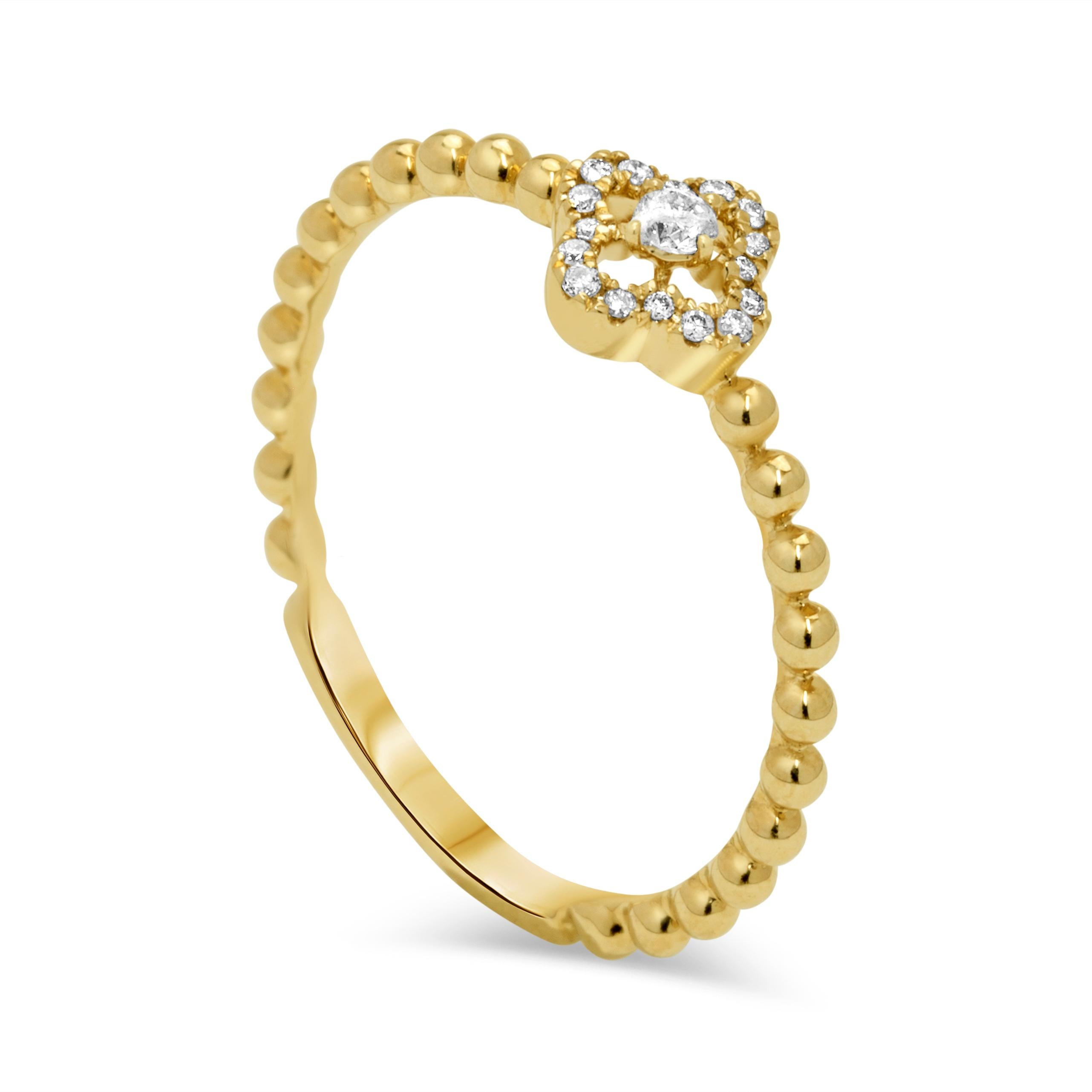 Bague de mode en or jaune 14k, ornée de diamants ronds totalisant 0,08 carats. Les diamants sont classés G-H pour la couleur, ce qui signifie qu'ils sont presque incolores et de bonne qualité, et ont un indice de pureté SI (Slightly Included), ce