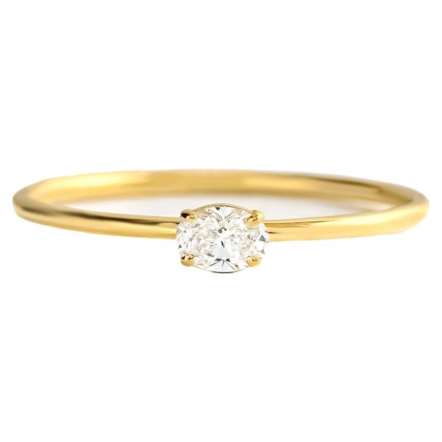 Delicate 14k gold ring with oval moissanite  For Sale