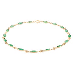 Delicada pulsera de cadena con esmeralda talla marquesa de 2,63 qt incrustada en oro amarillo de 14 quilates