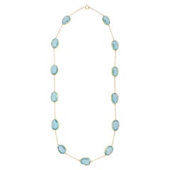 Collier  chane dlicate en or jaune 18 carats avec topaze bleue de 47,55 carats