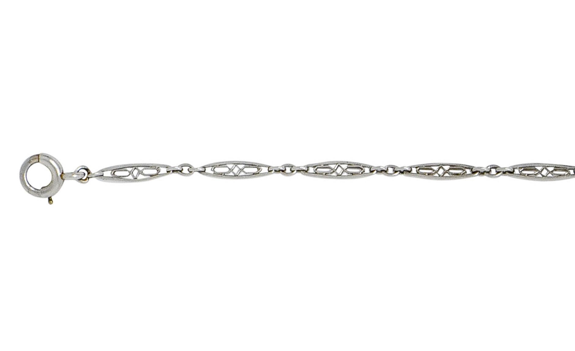 Bracelet comprised of pierced elongated links, each featuring geometric filigree

Alternating with jump ring spacer links

Completed by spring ring clasp

Tested as platinum

Circa: 1930s

Length: 7 1/4 inches

Width: 1/8 inch

Total weight: 2.0