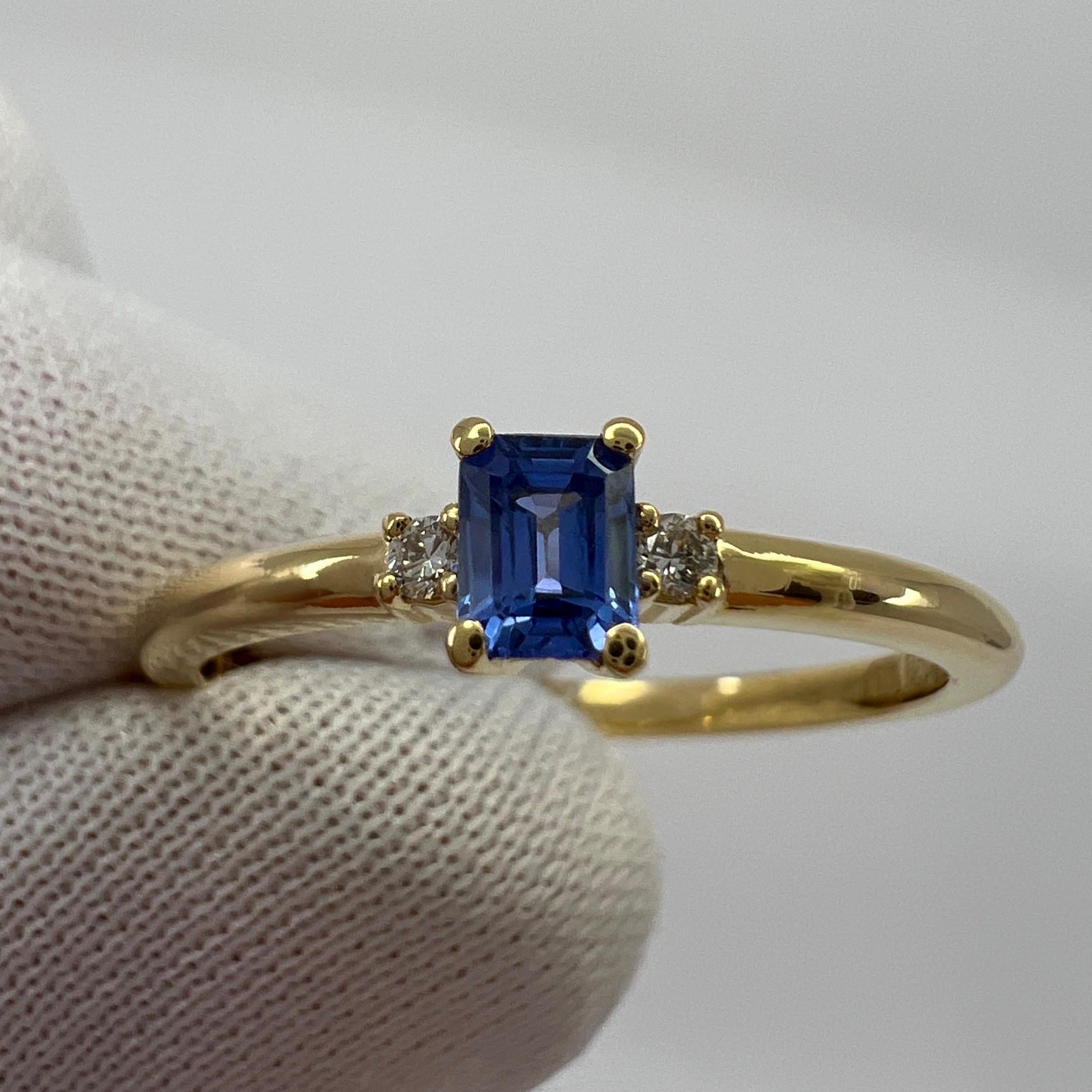 Natural Ceylon Blue Emerald Cut Sapphire & Diamond Three Stone 18k Yellow Gold Thin Ring.

Fine vivid blue emerald cut natural Ceylon sapphire centre stone. 0.25 carat measuring 3.8x2.8mm. Excellent emerald/octagon cut and excellent