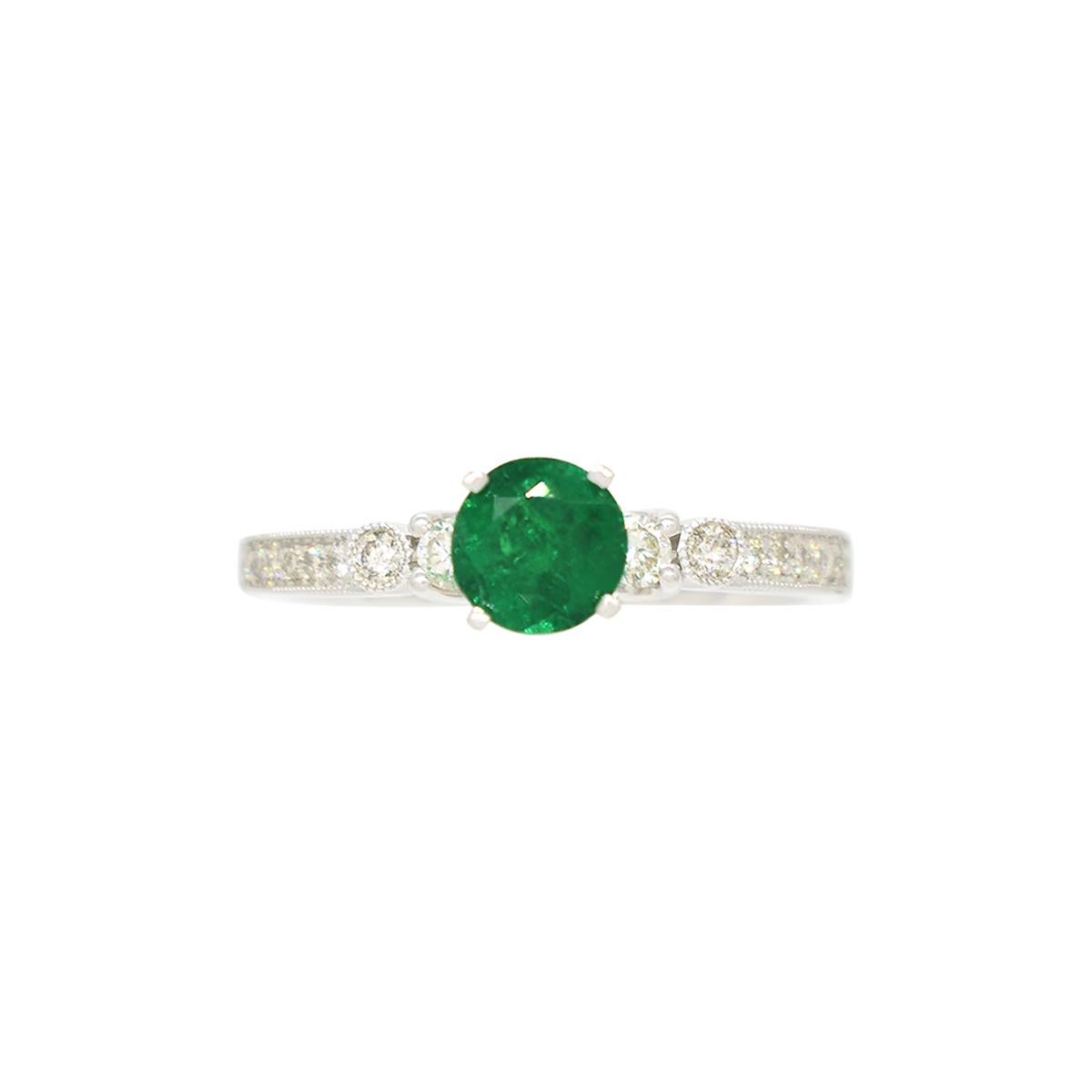 Romantic 0.50 Carats Colombian Emerald Engagement Ring in White Gold with Round Diamonds For Sale