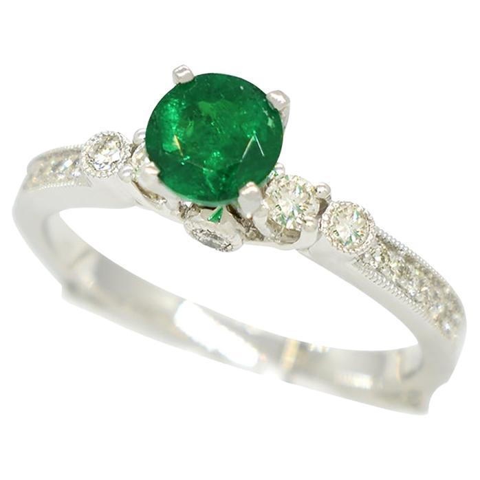 0.50 Carats Colombian Emerald Engagement Ring in White Gold with Round Diamonds For Sale