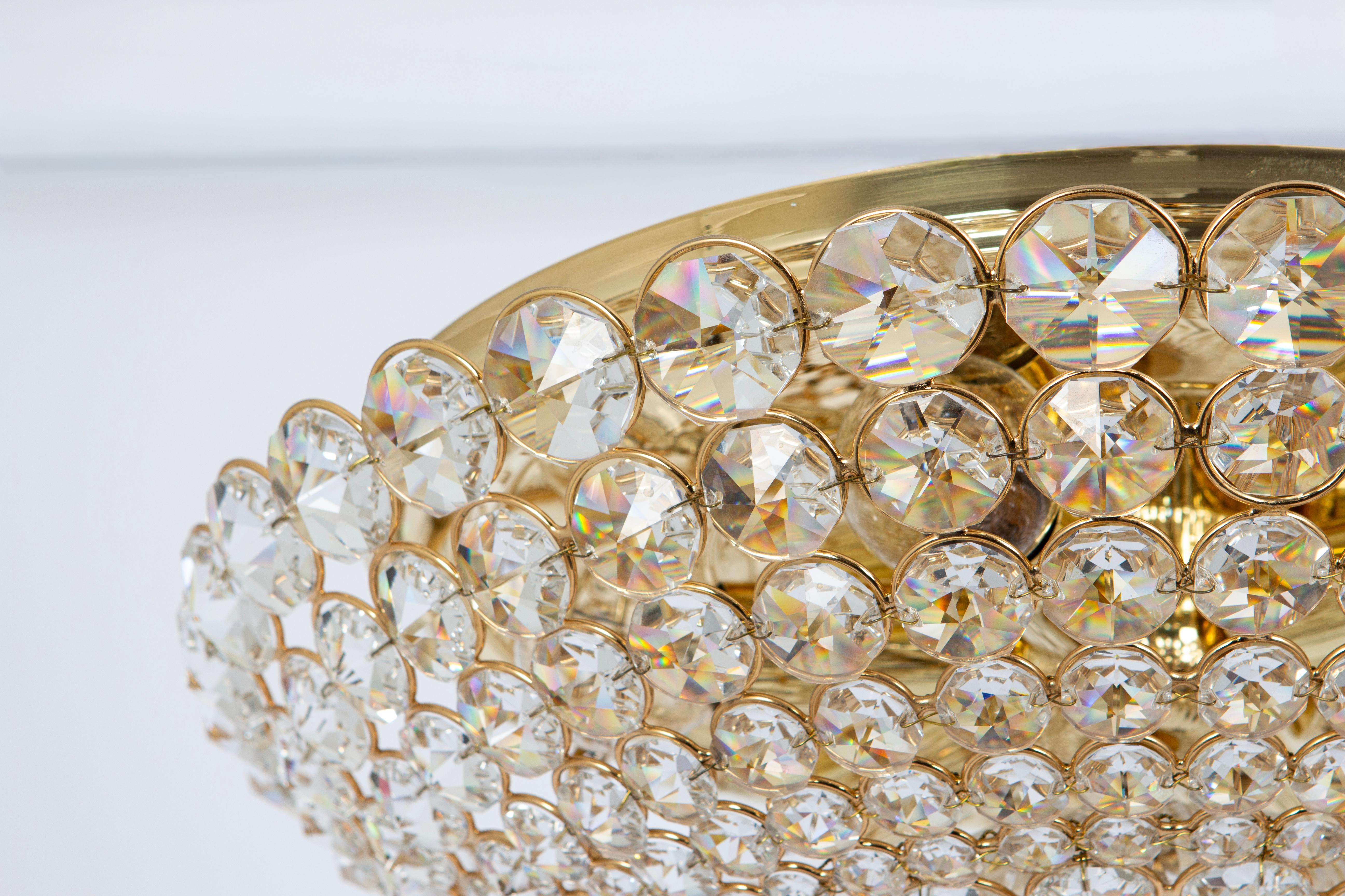 Large delicate floral flush mount with crystal glasses ( Swarovski) and gilded brass parts made by Palwa, Germany, in the 1970s.
Measures: Diameter 16