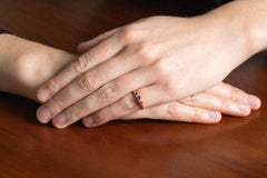 Delicate gold ring with rubies and diamonds.