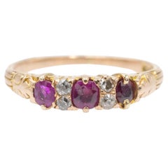 Delicate gold ring with rubies and diamonds.